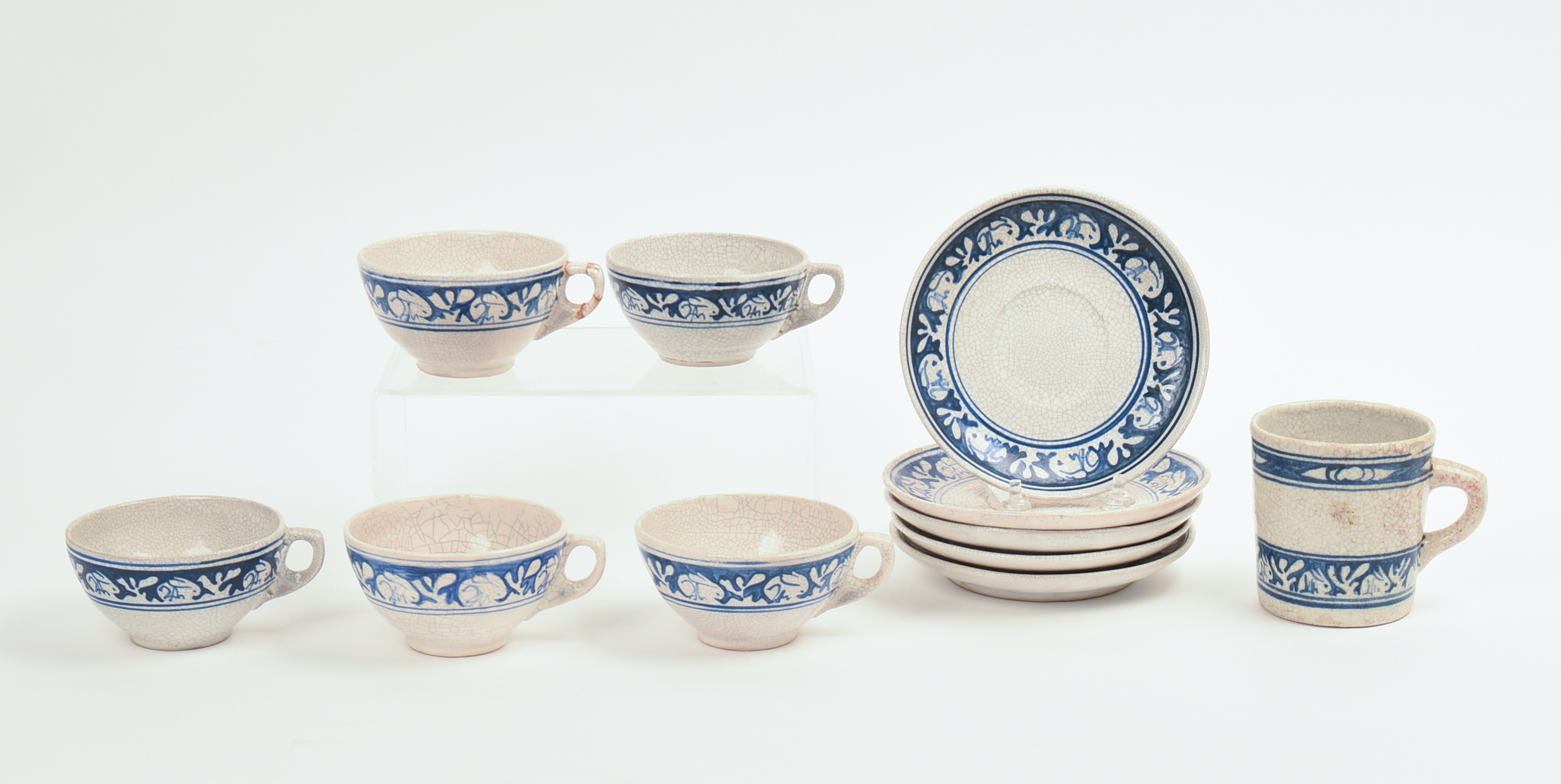 FIVE DEDHAM POTTERY RABBIT PATTERN TEACUPS AND SAUCERS AND A MUG