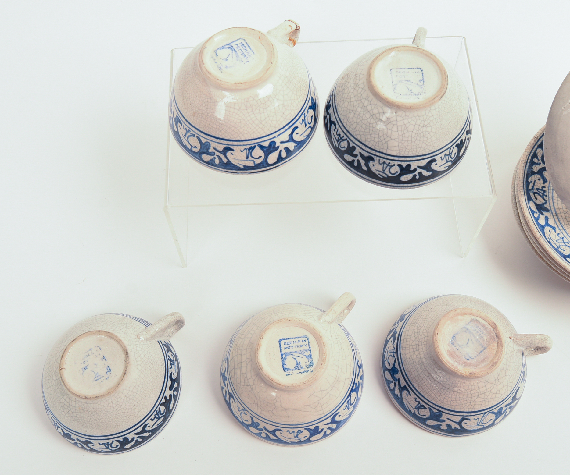 FIVE DEDHAM POTTERY RABBIT PATTERN TEACUPS AND SAUCERS AND A MUG