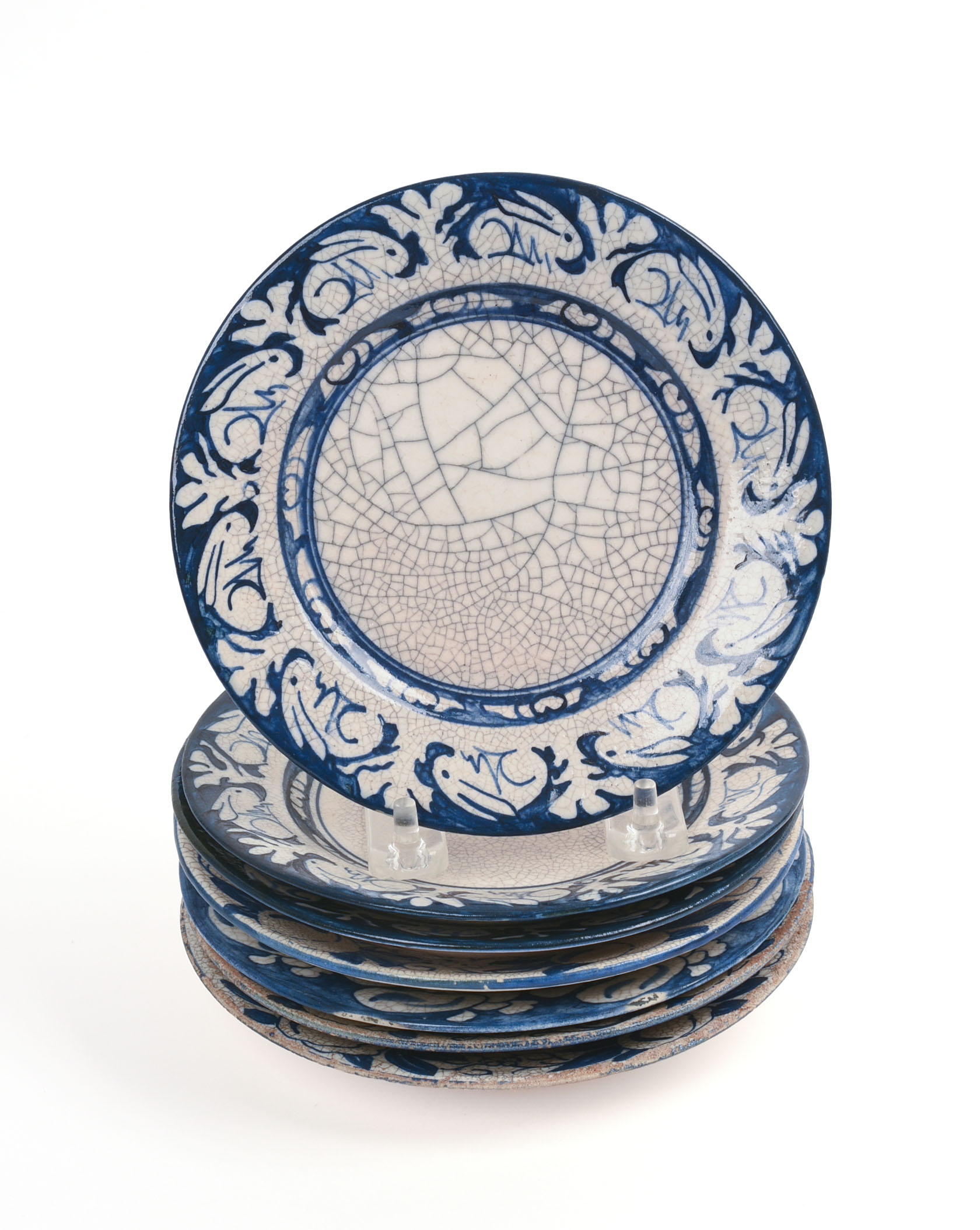 SEVEN SMALL DEDHAM POTTERY PLATES.