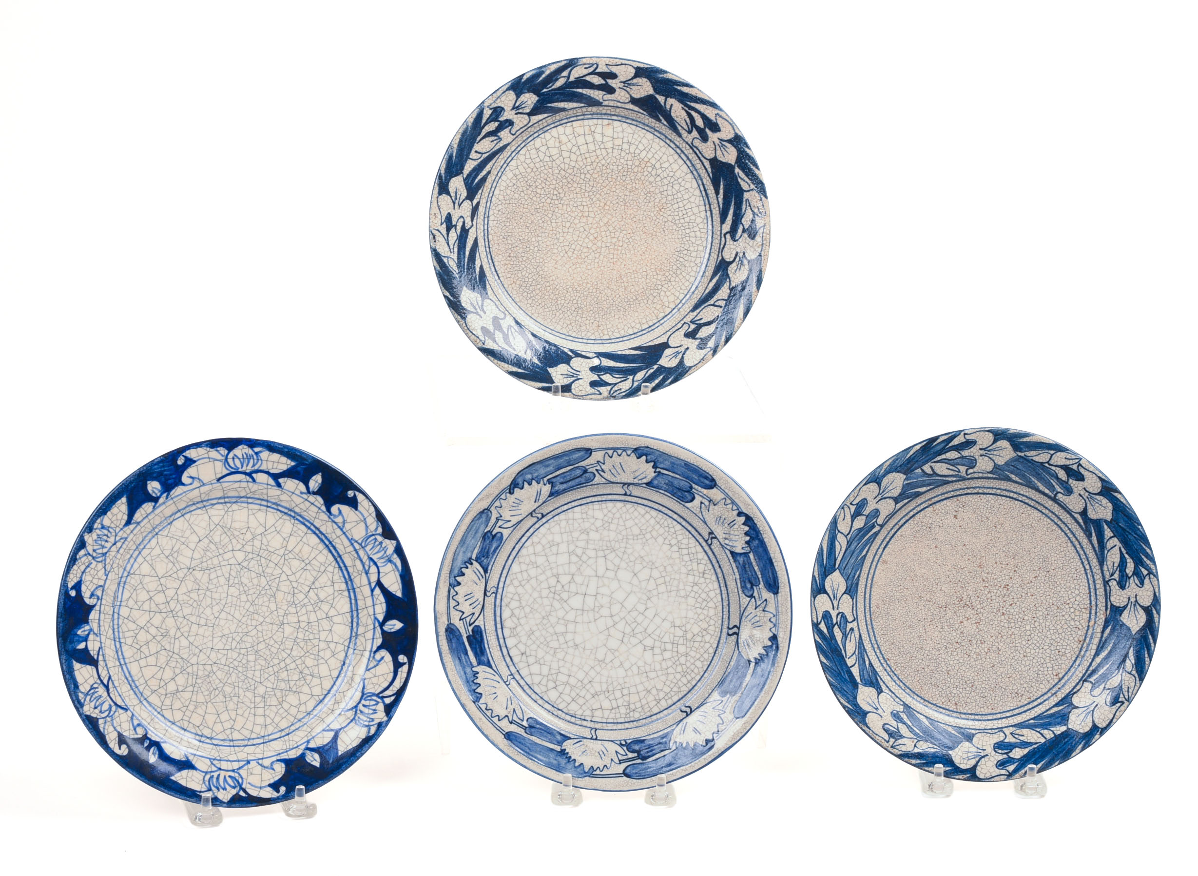 FOUR DEDHAM POTTERY FLORAL PATTERN PLATES.