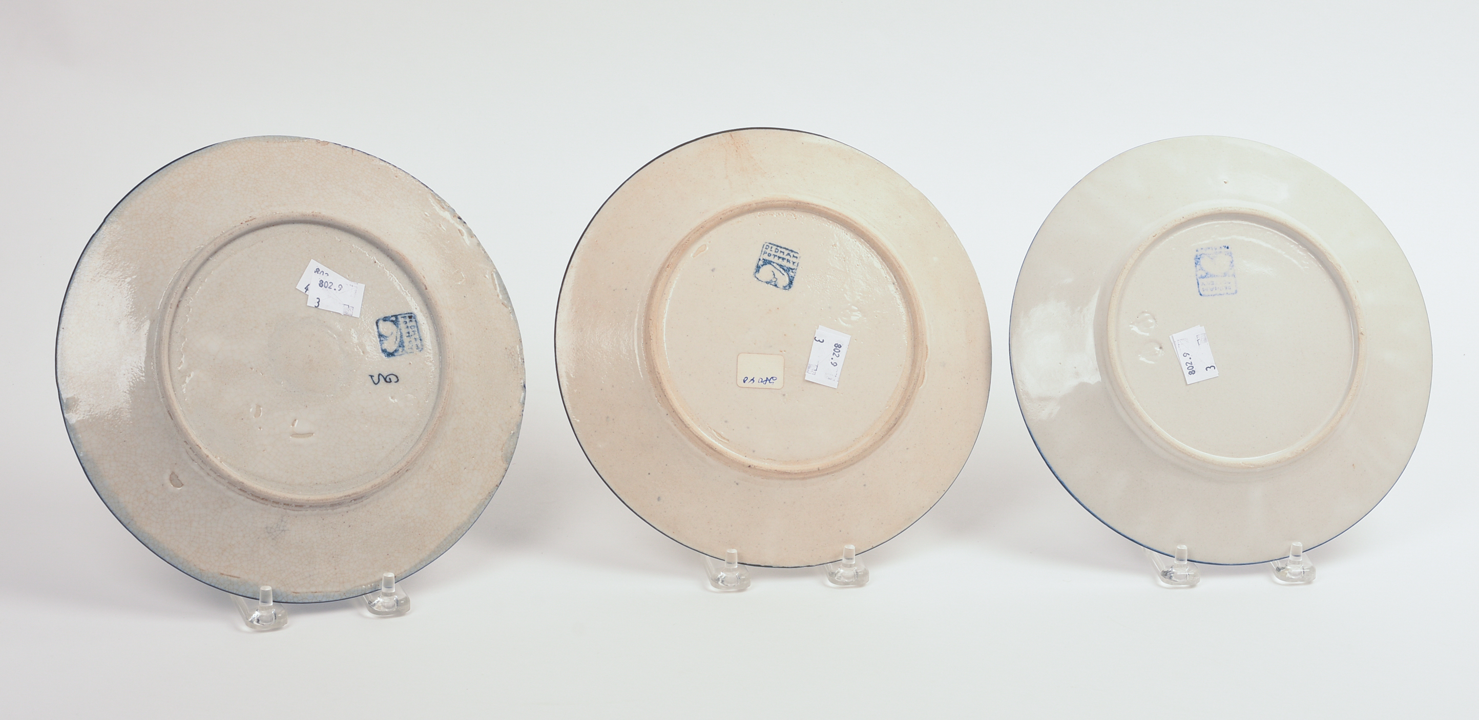 THREE DEDHAM POTTERY RABBIT PATTERN PLATES.