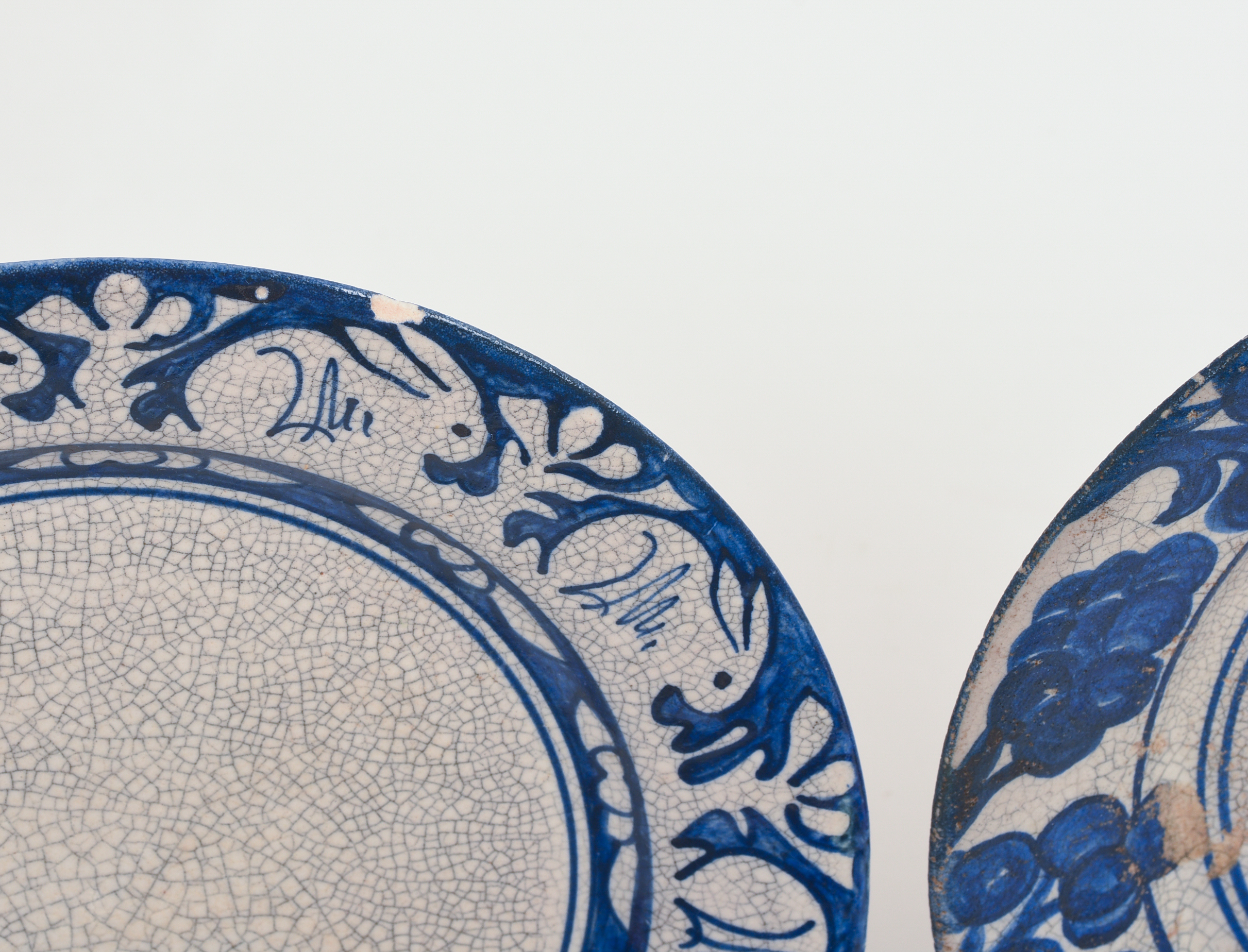 THREE DEDHAM POTTERY PLATES.