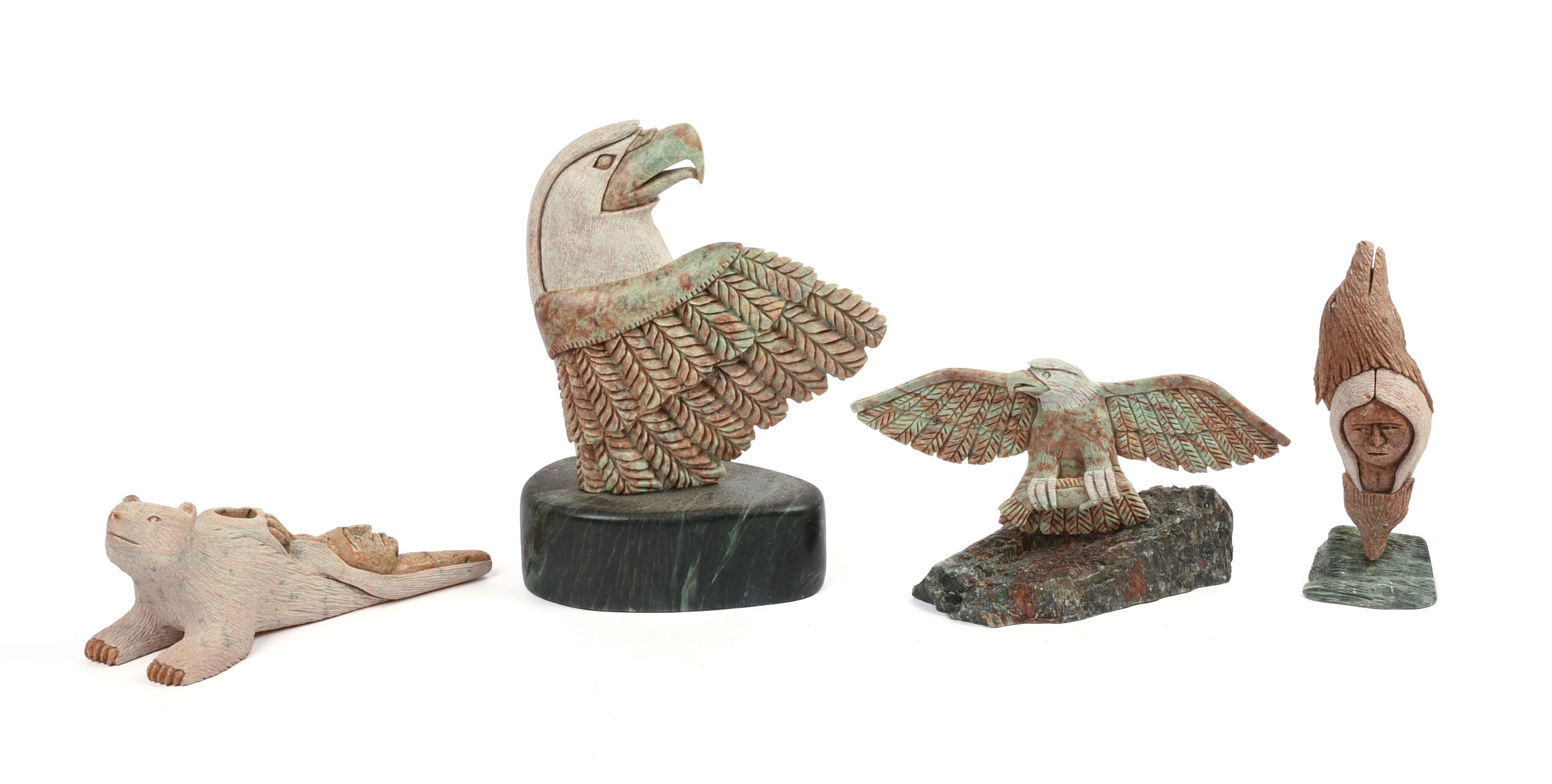 FOUR NATIVE AMERICAN CARVED STONE SCULPTURES.