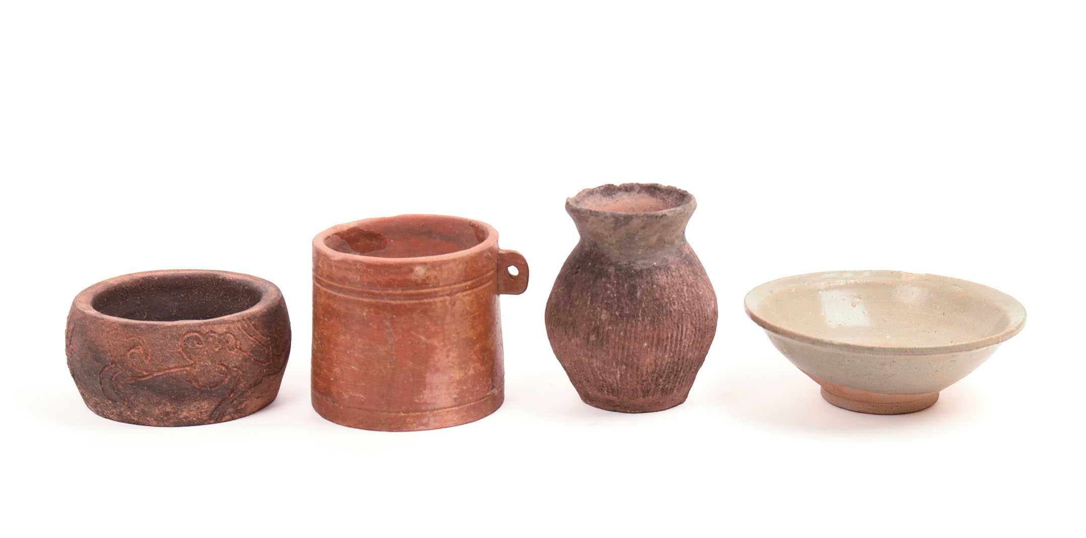 FOUR EARLY CHINESE CERAMIC PIECES.