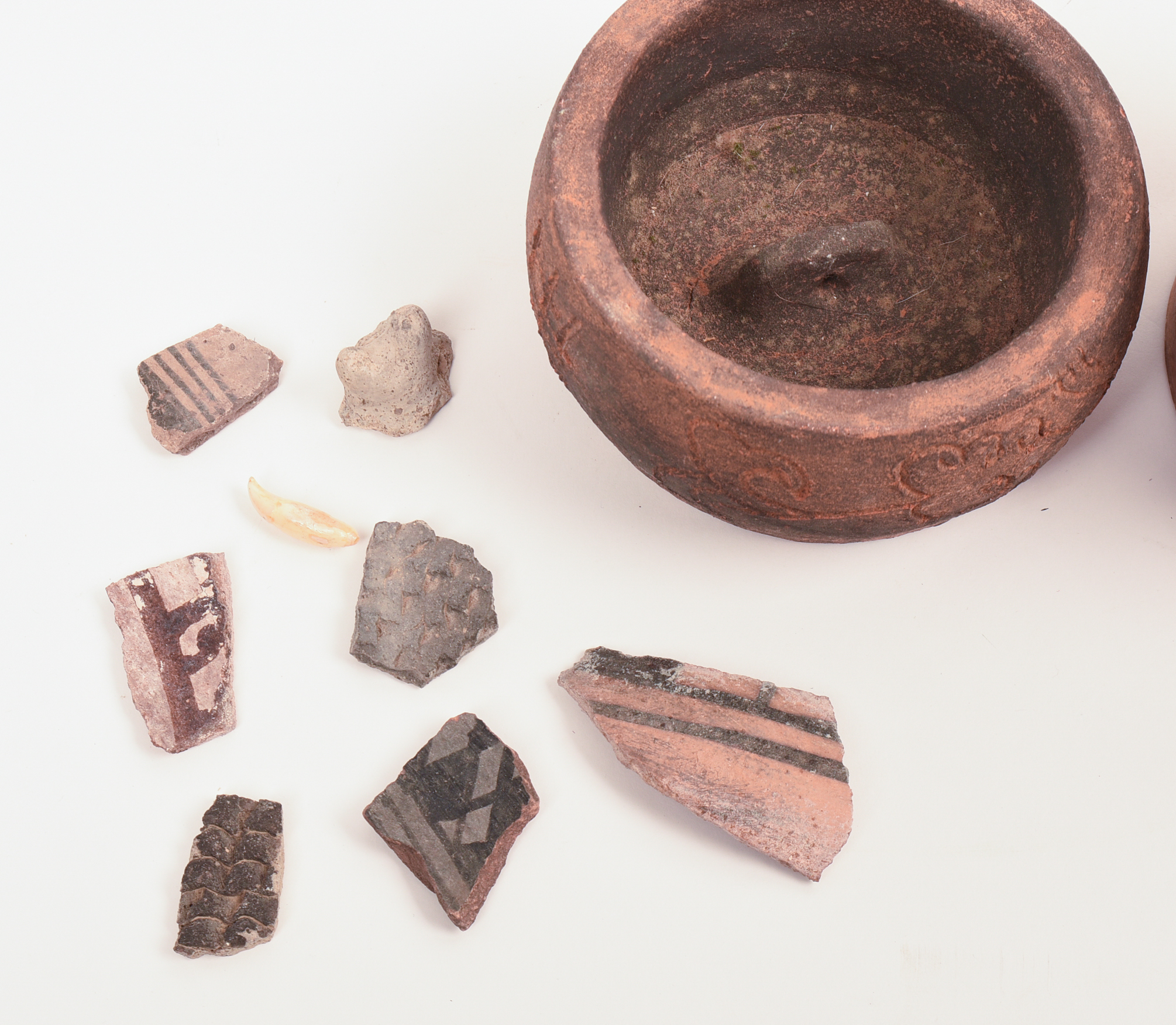 FOUR EARLY CHINESE CERAMIC PIECES.
