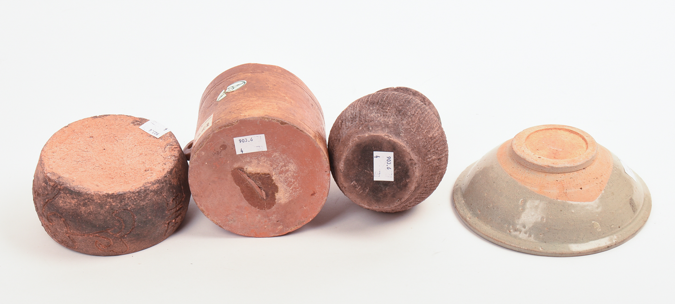 FOUR EARLY CHINESE CERAMIC PIECES.