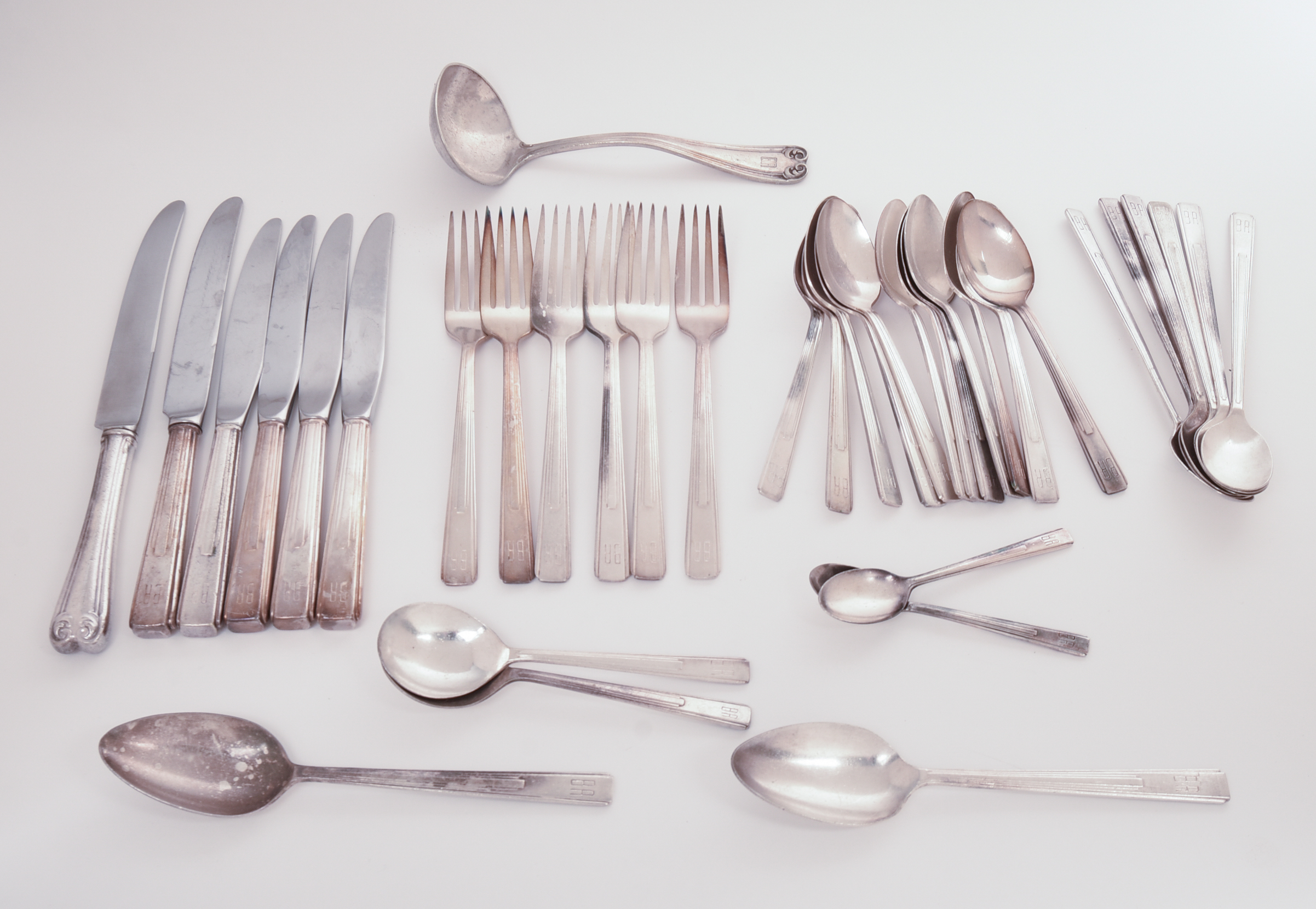 BURLINGTON RAILROAD SILVERPLATE FLATWARE SET.
