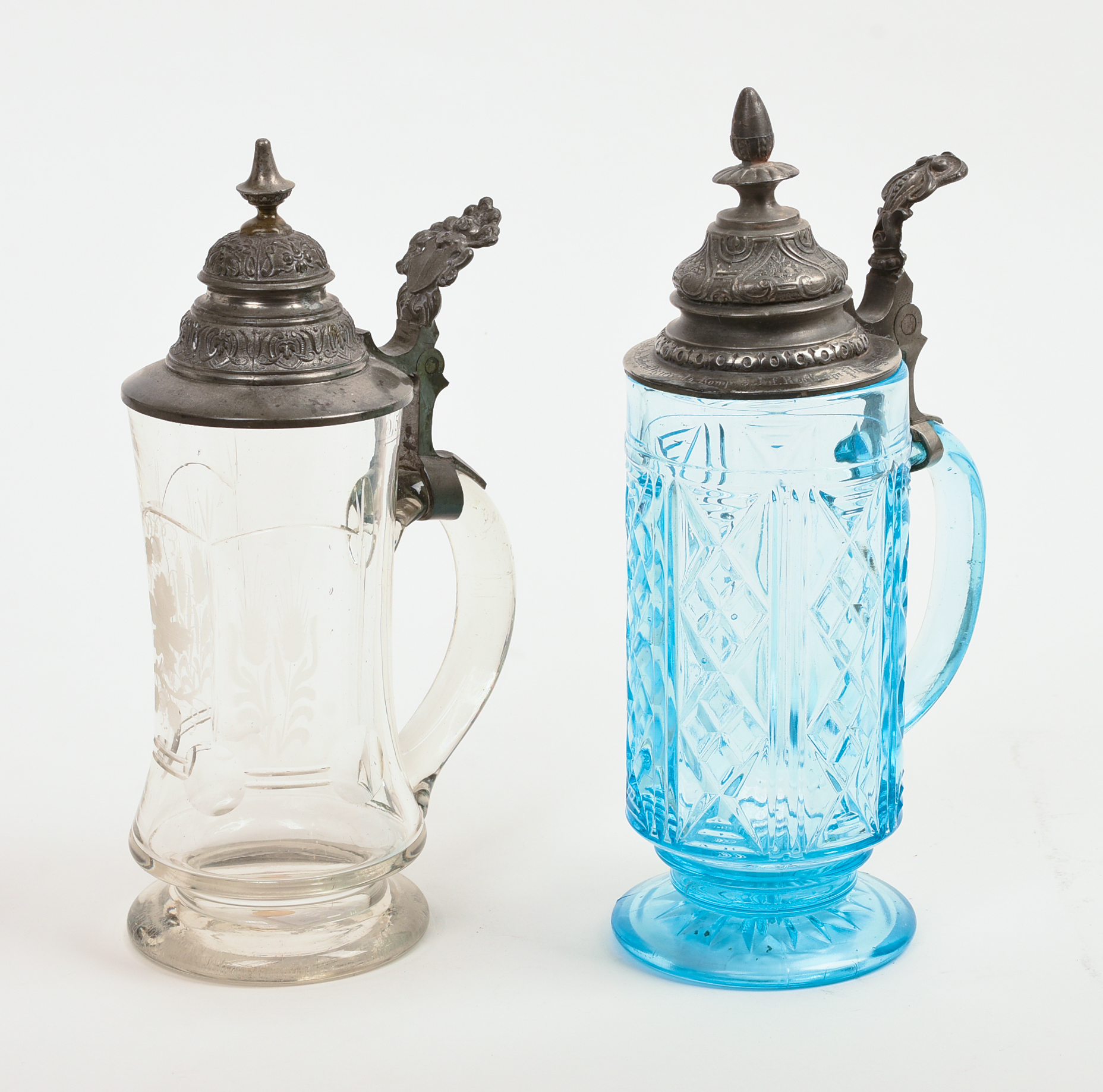 Two Glass Steins With Pewter Tops.