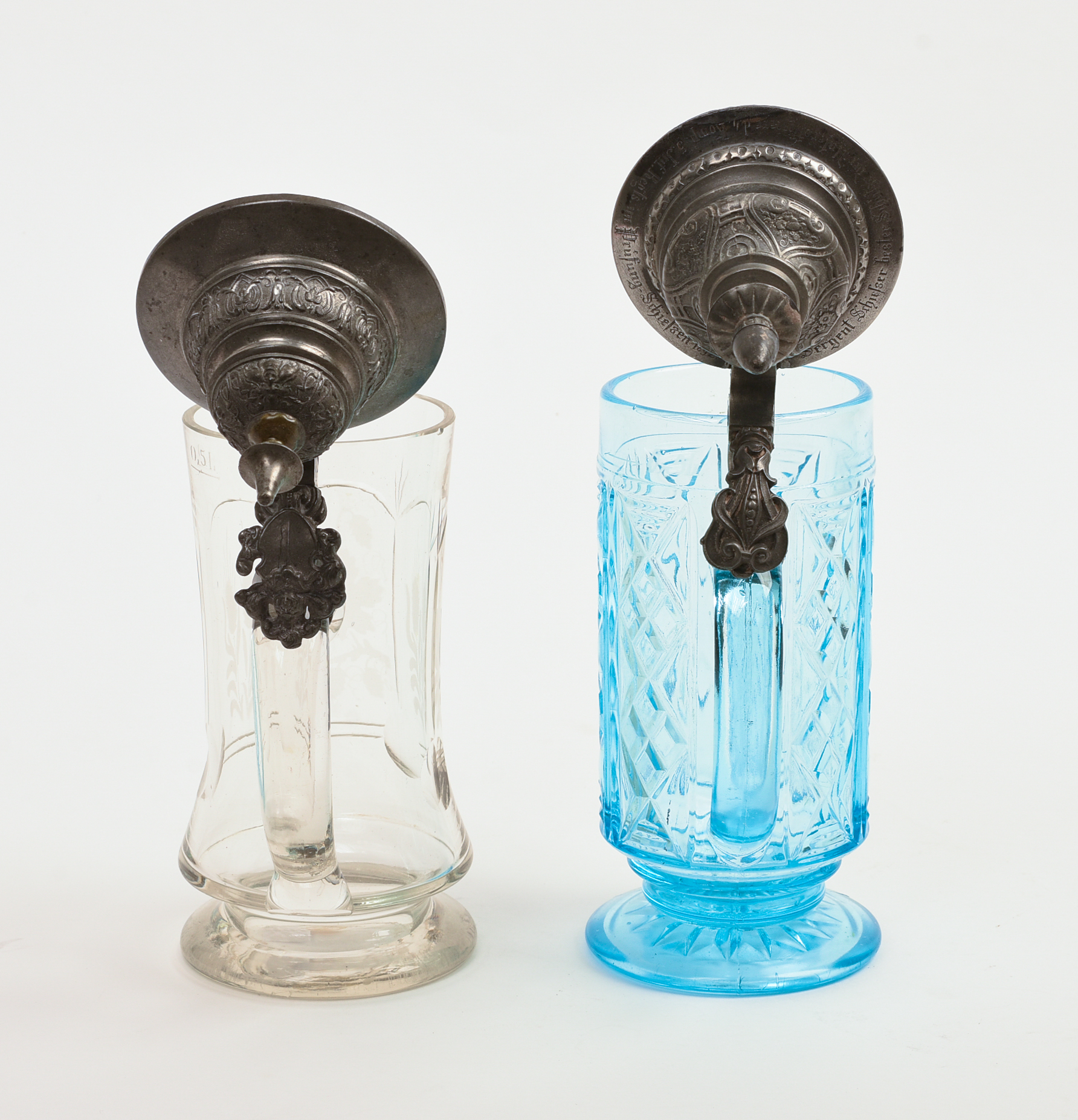 Two Glass Steins With Pewter Tops.