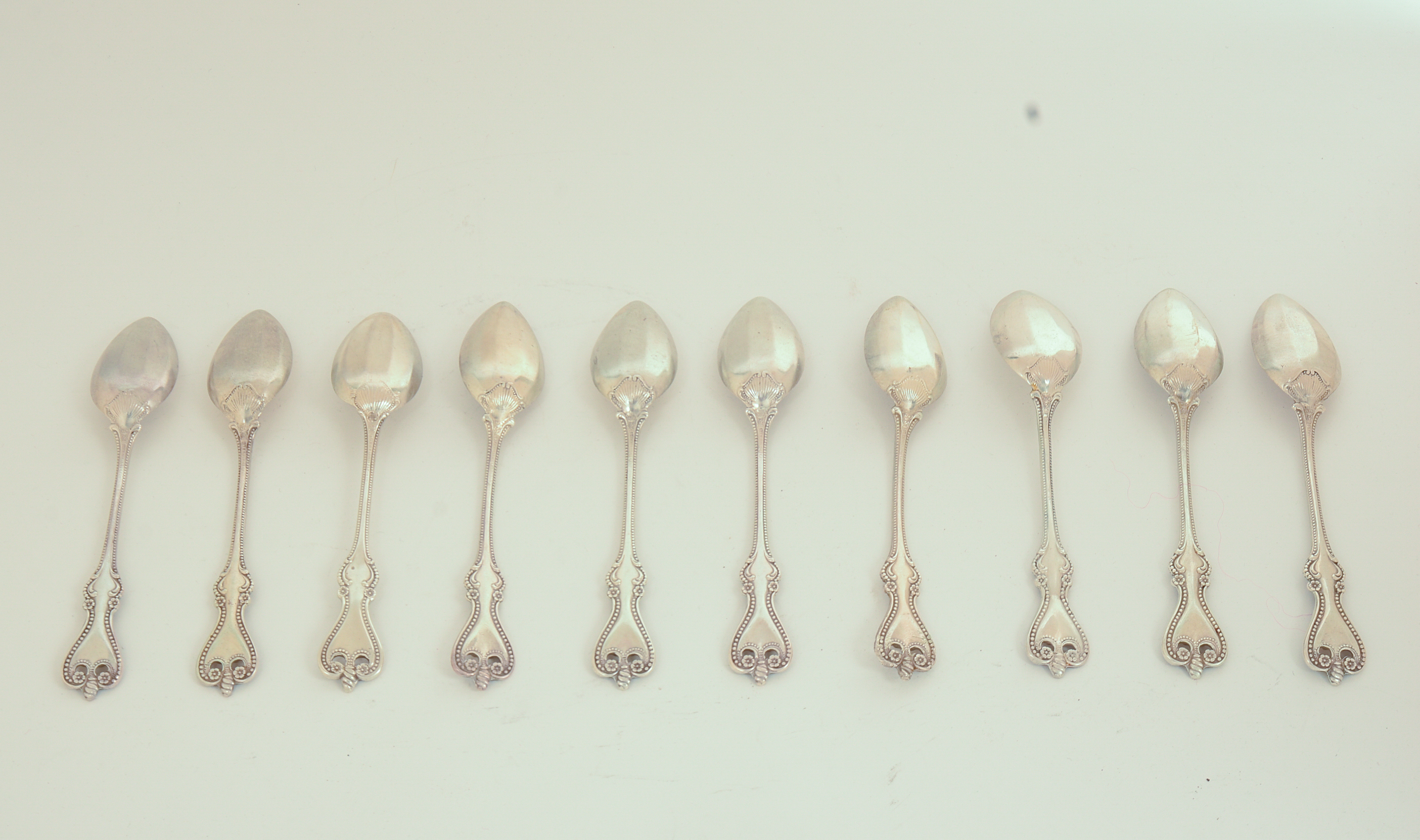 Ten Sterling Silver Grapefruit Spoons.
