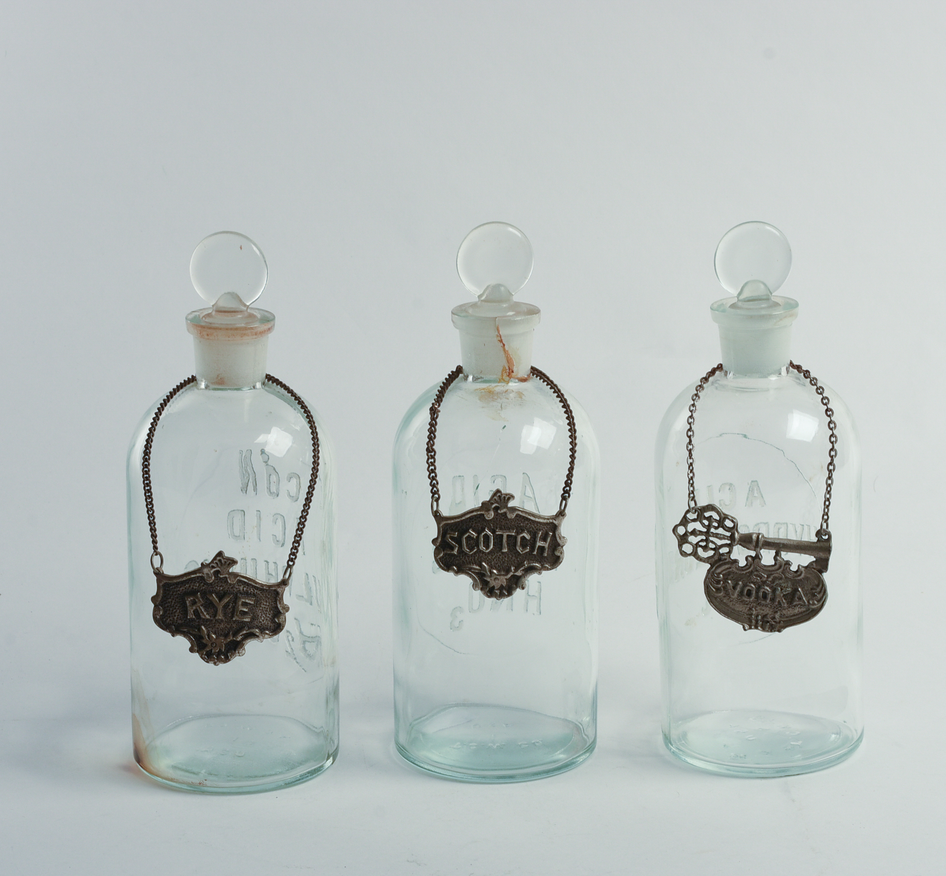Three Blown Glass Acid Bottles.