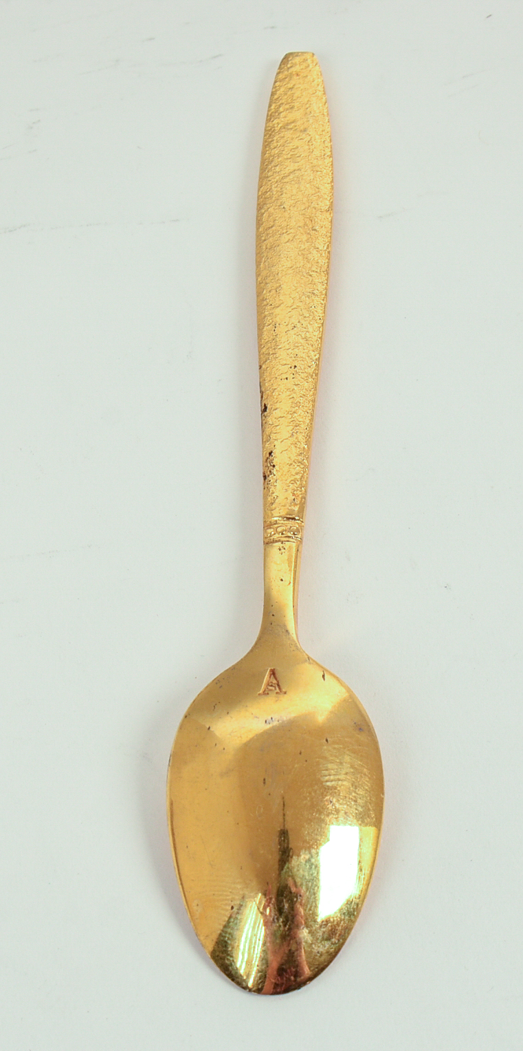 Eight Gold Wash Demitasse Spoons.