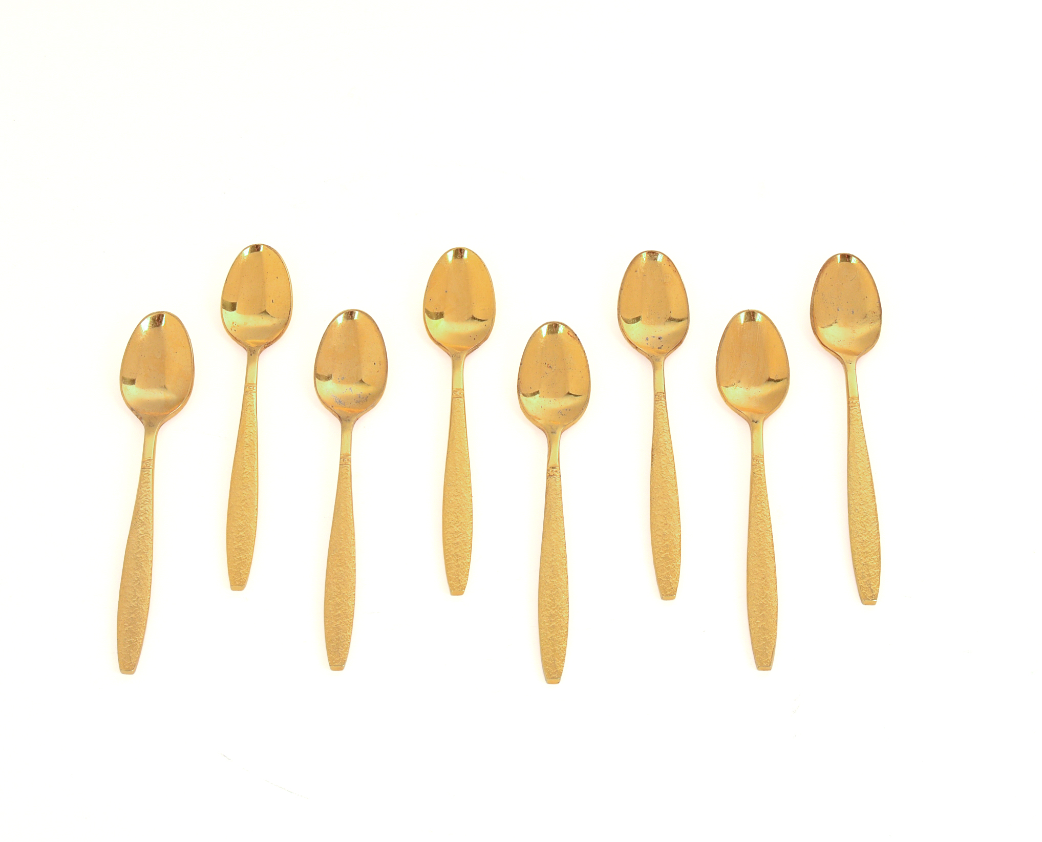 Eight Gold Wash Demitasse Spoons.