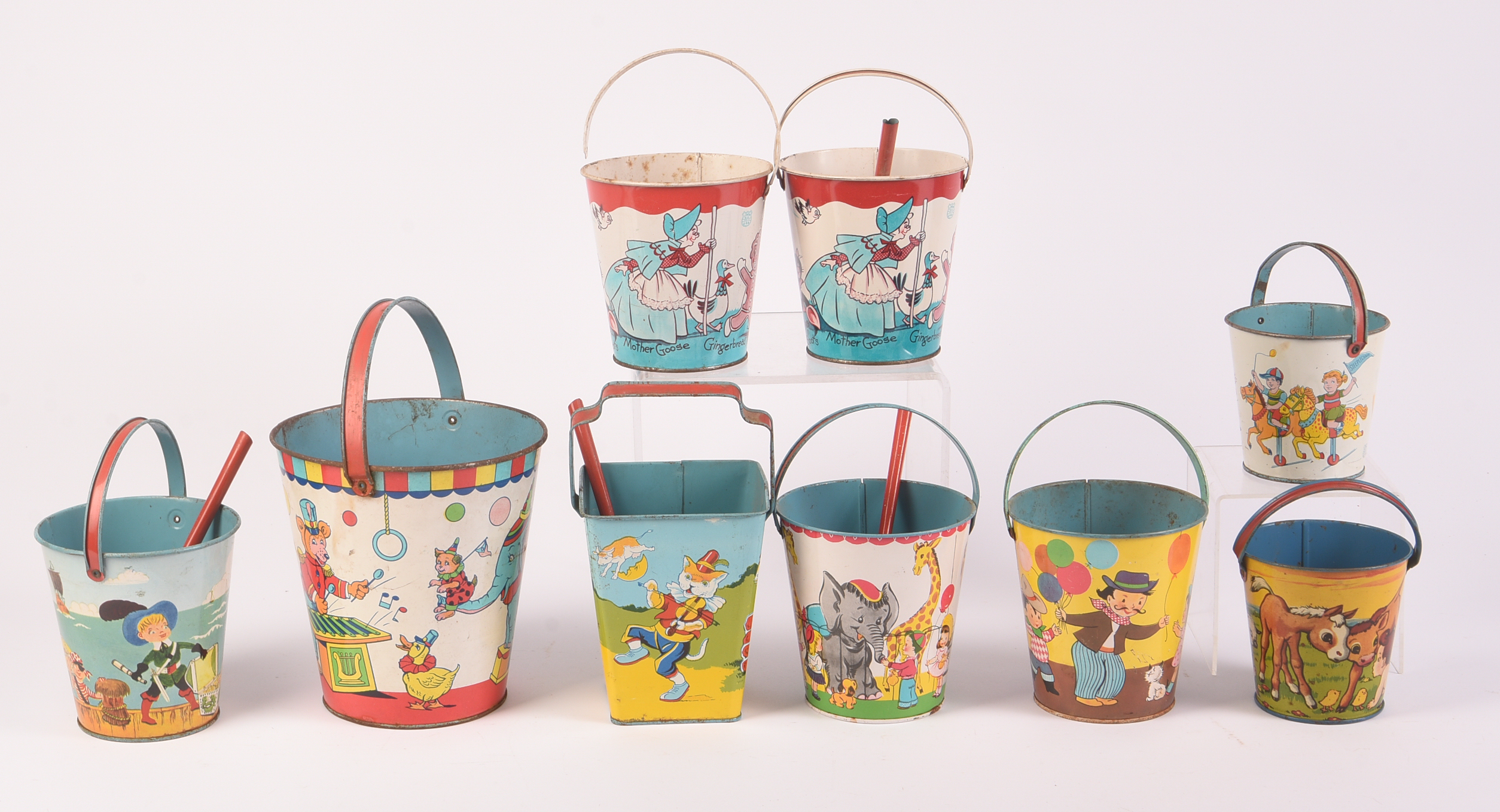 Nine Vintage Metal Children's Beach Pails.