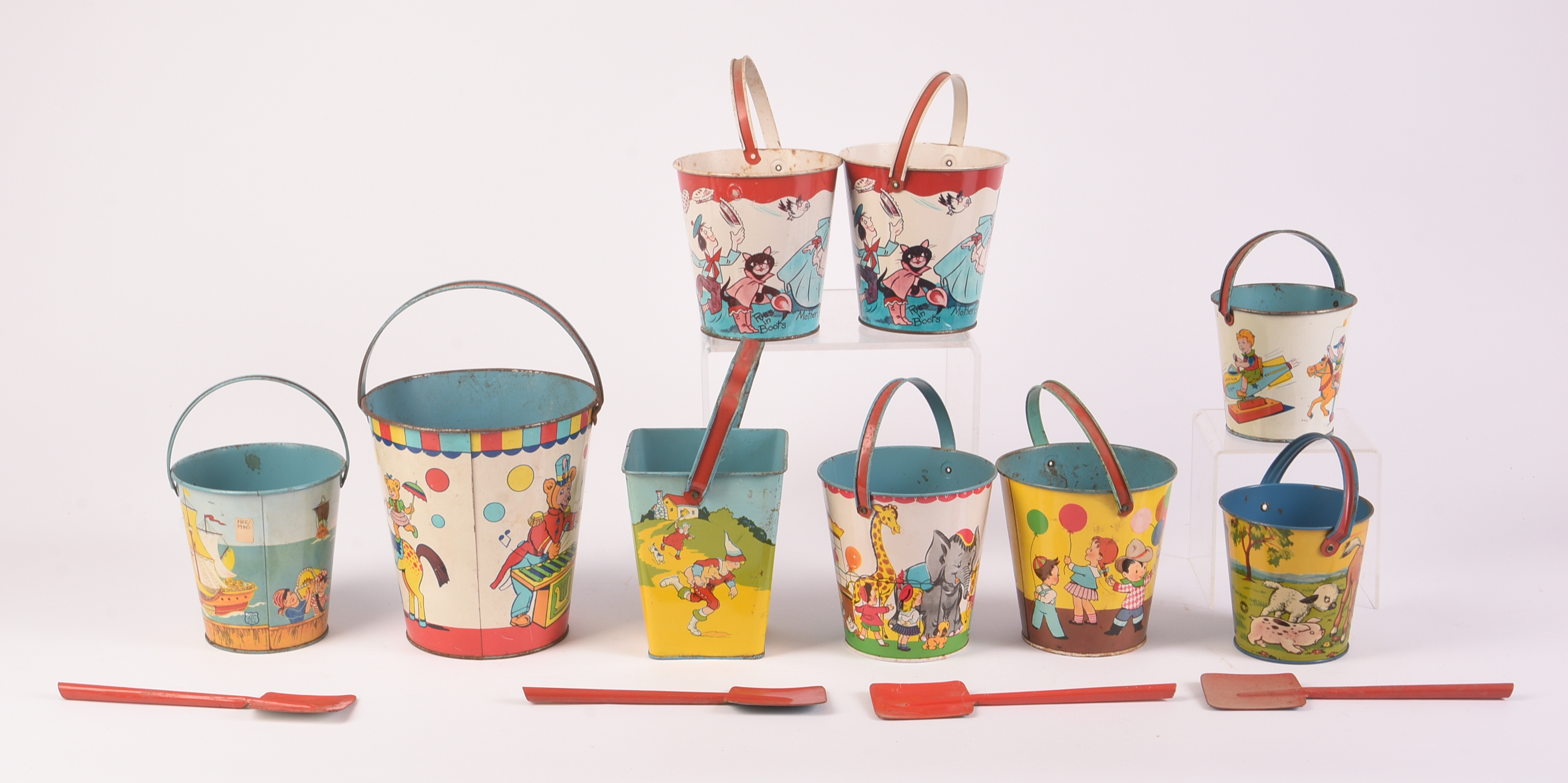 Nine Vintage Metal Children's Beach Pails.