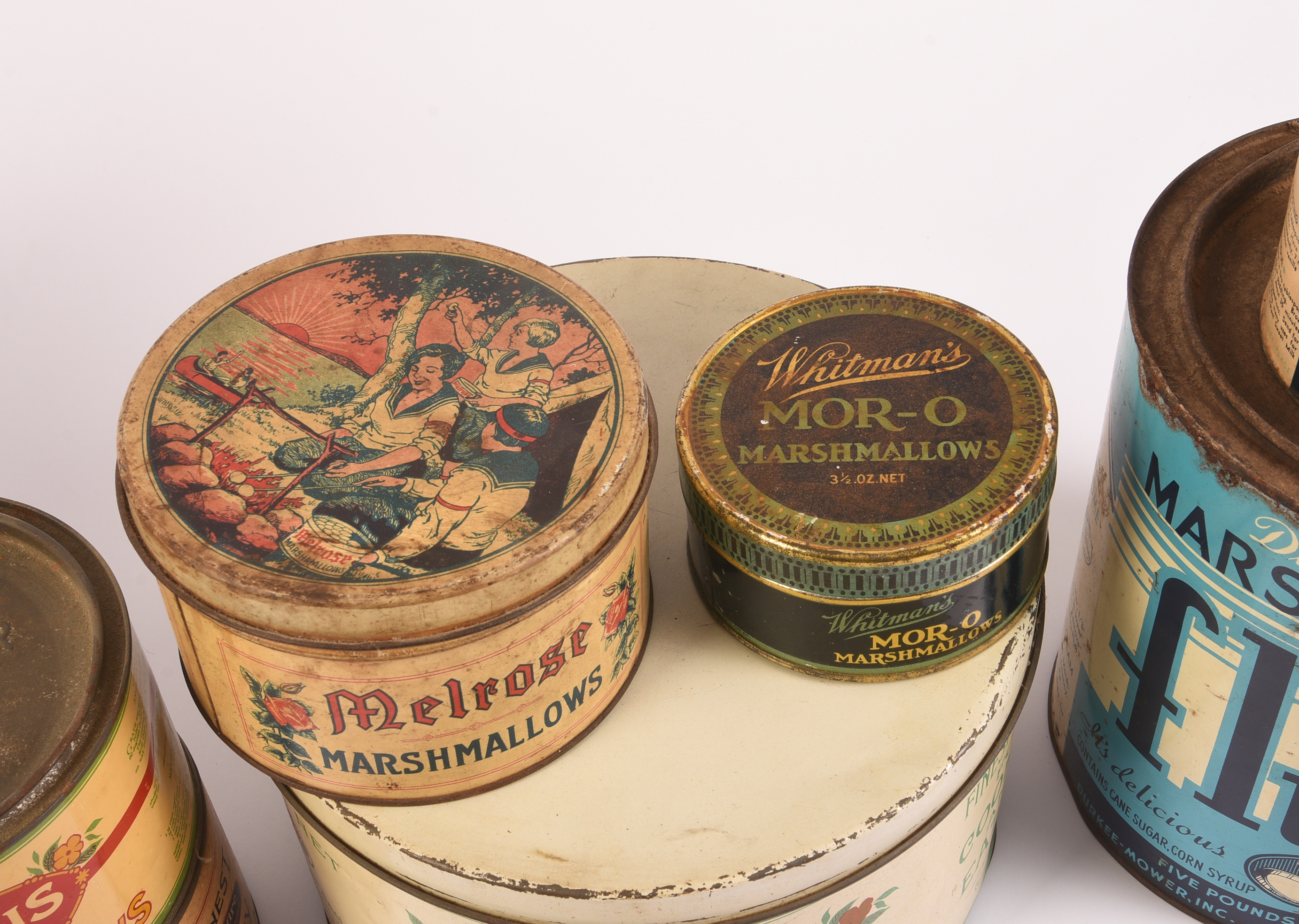 Nine Vintage Marshmallow Tins.