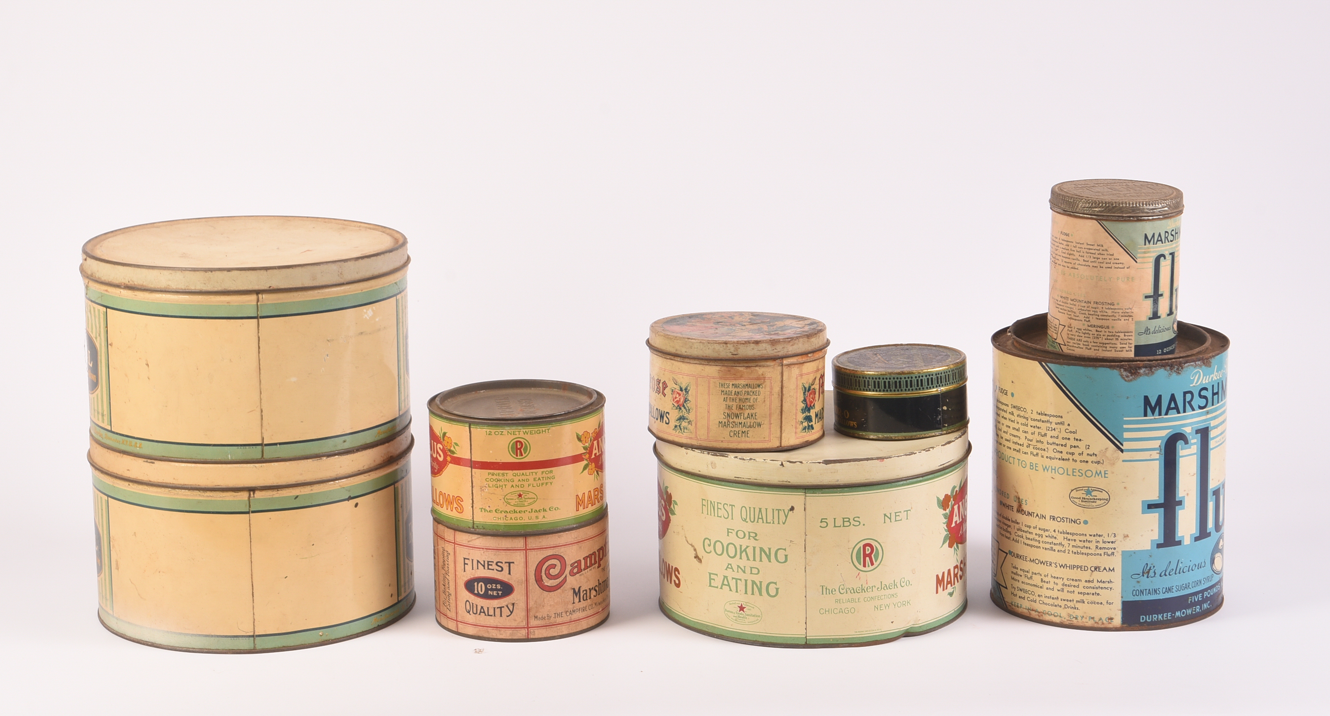 Nine Vintage Marshmallow Tins.
