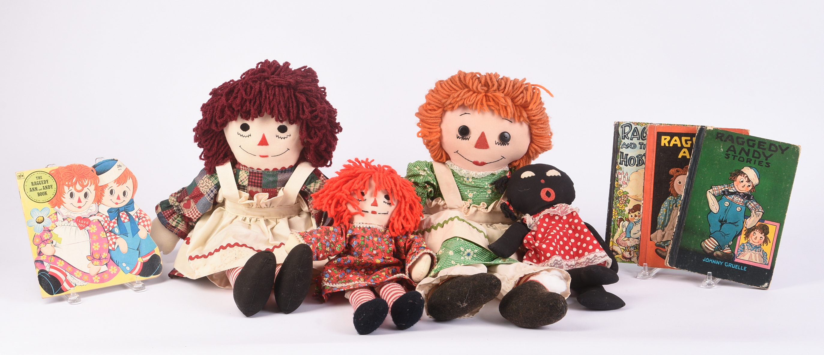 Group of Raggedy Ann Dolls and Books.