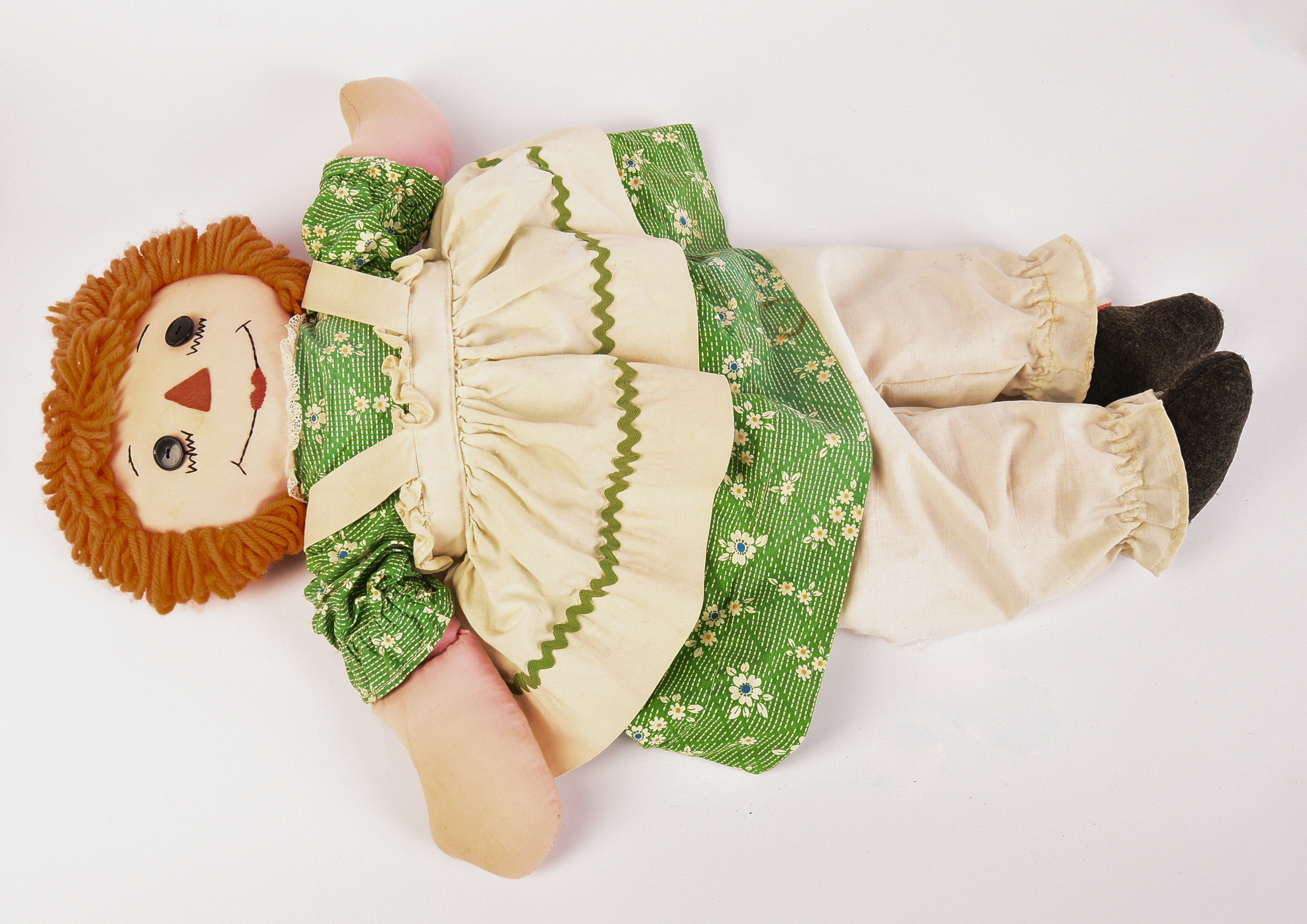 Group of Raggedy Ann Dolls and Books.