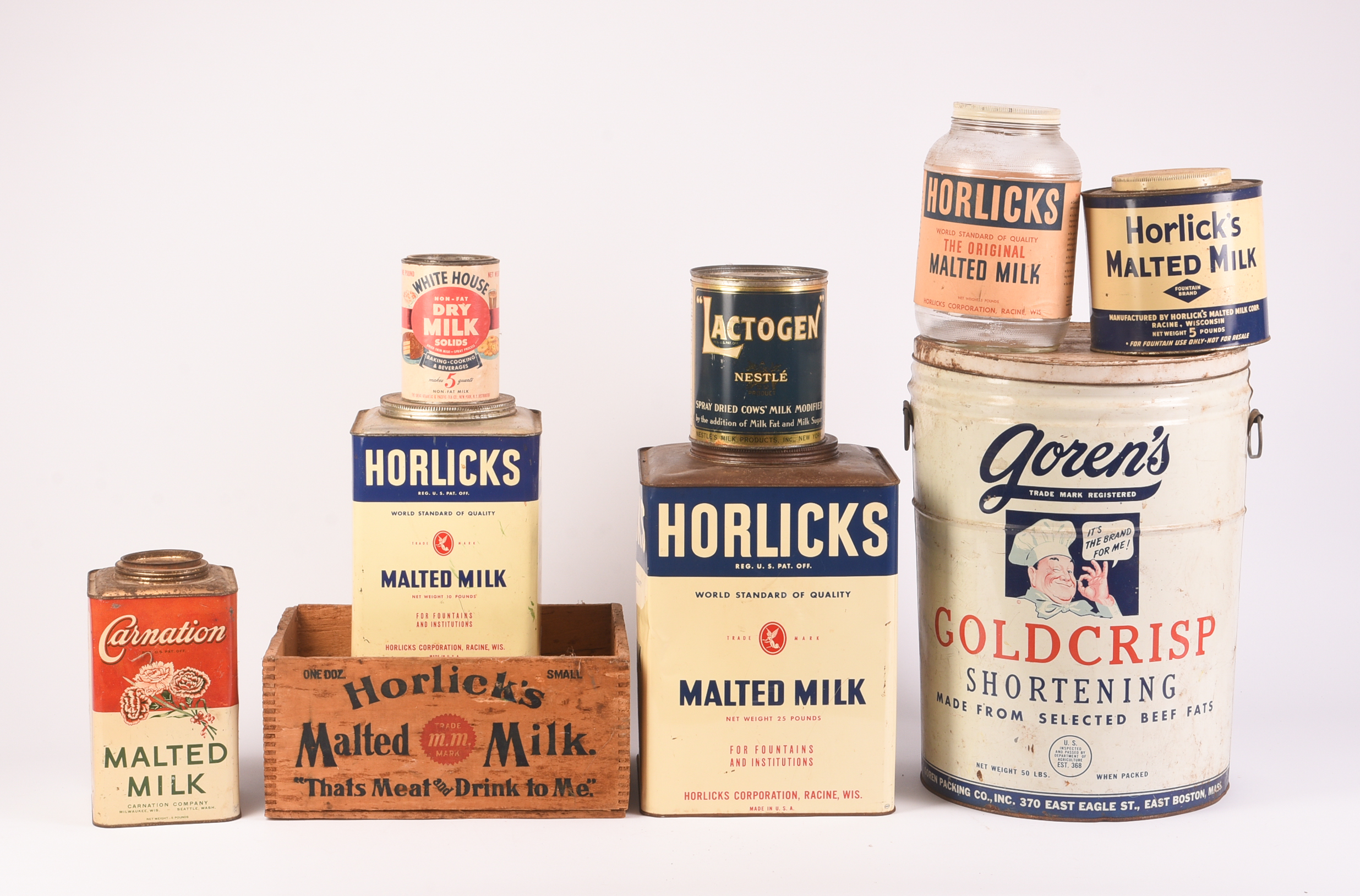 Eight Dried Milk Containers.