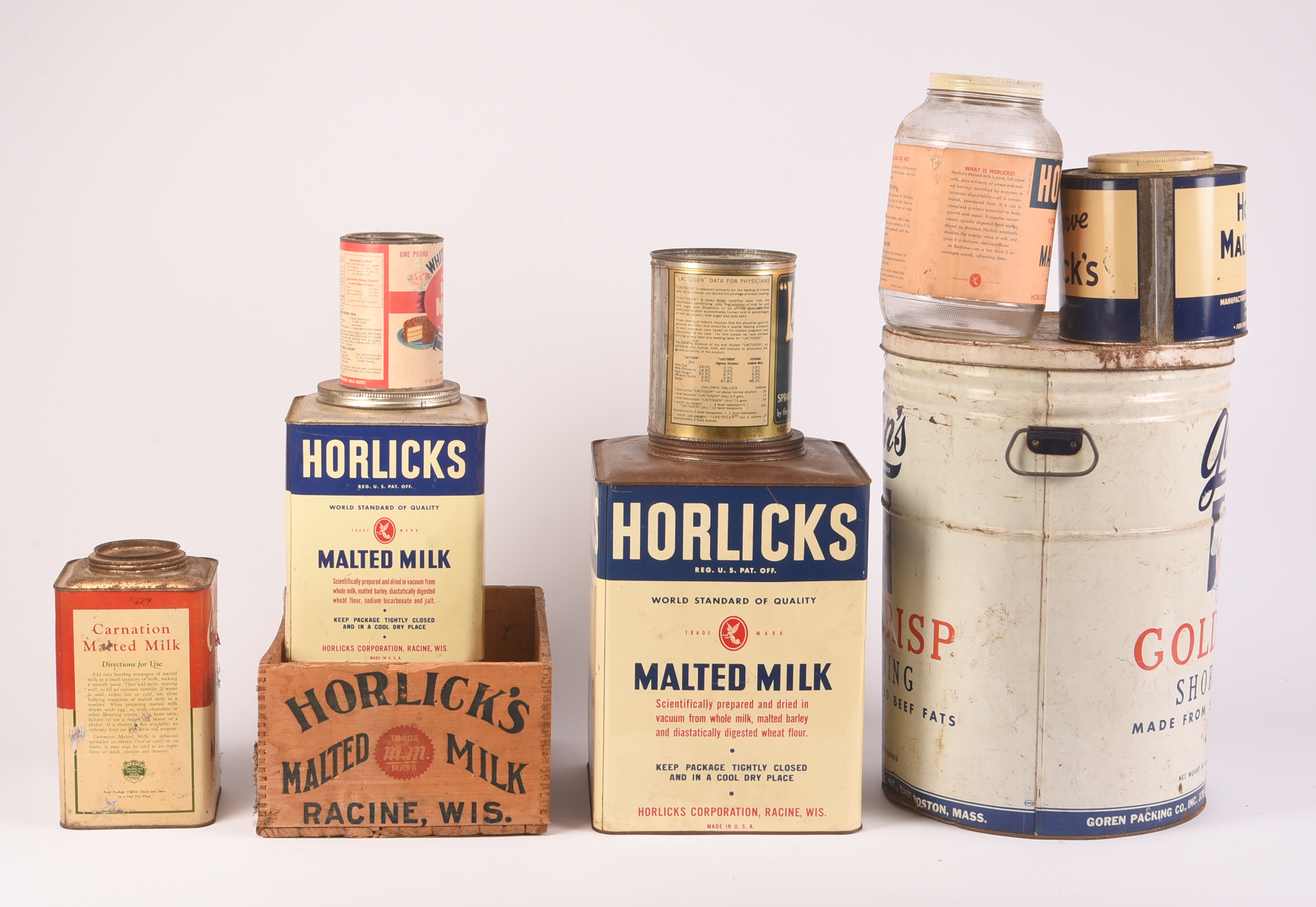 Eight Dried Milk Containers.