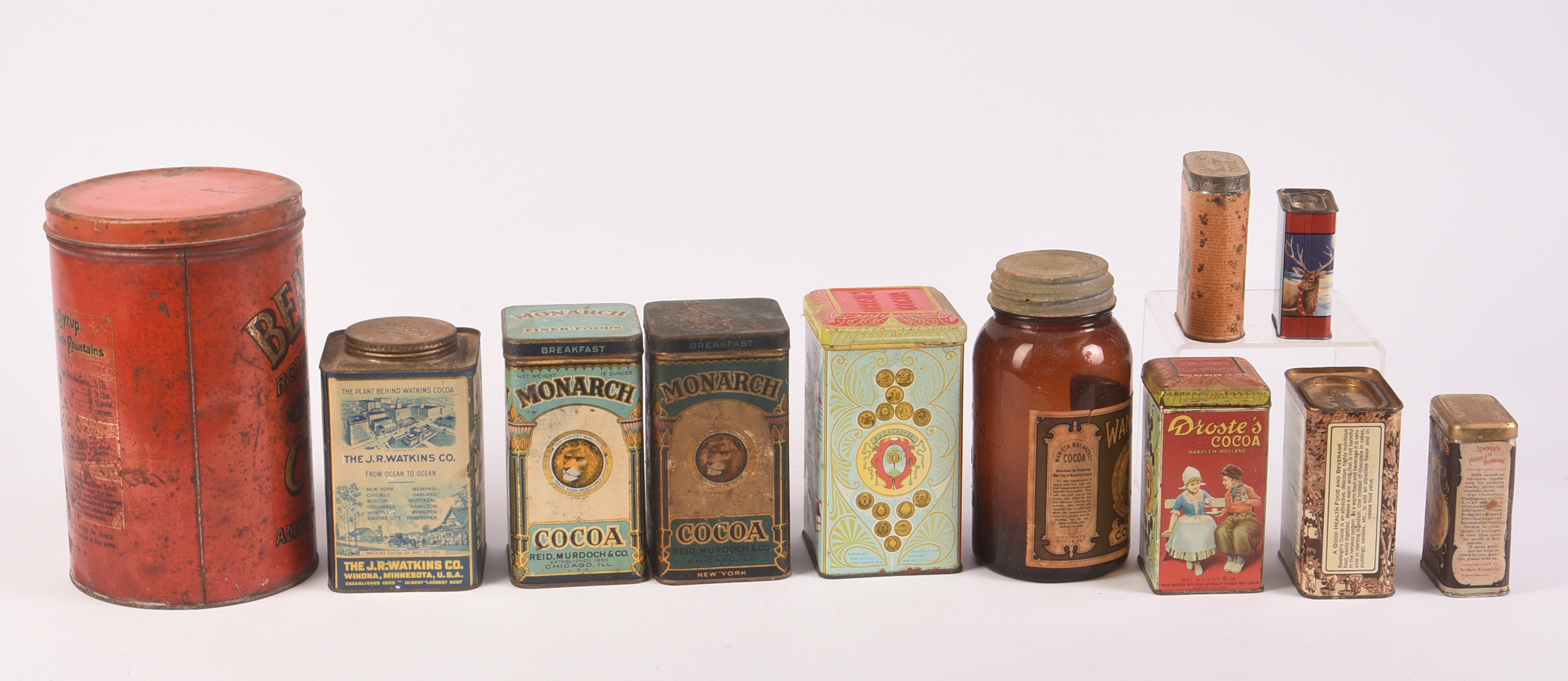 Ten Cocoa Vintage Tins and a Jar.