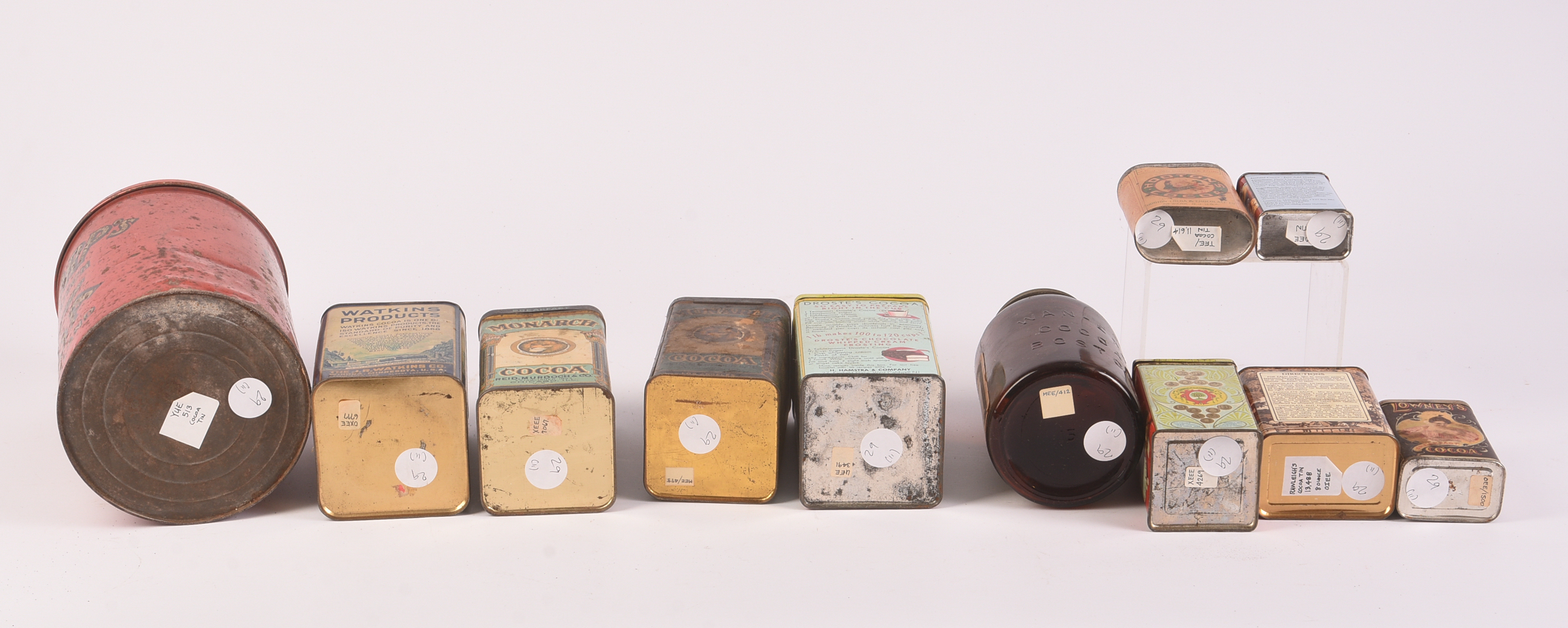 Ten Cocoa Vintage Tins and a Jar.
