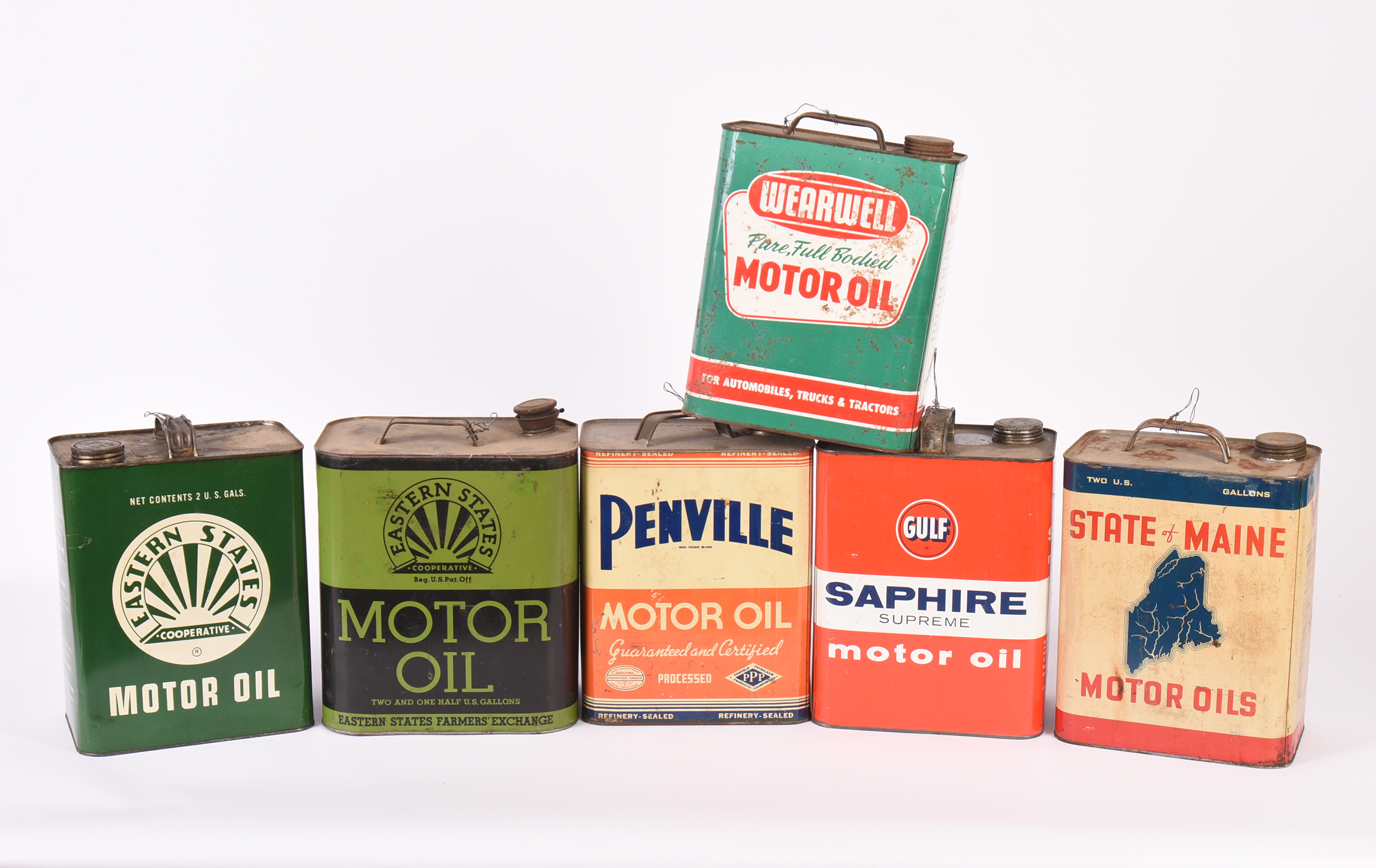 Six Vintage Motor Oil Cans.