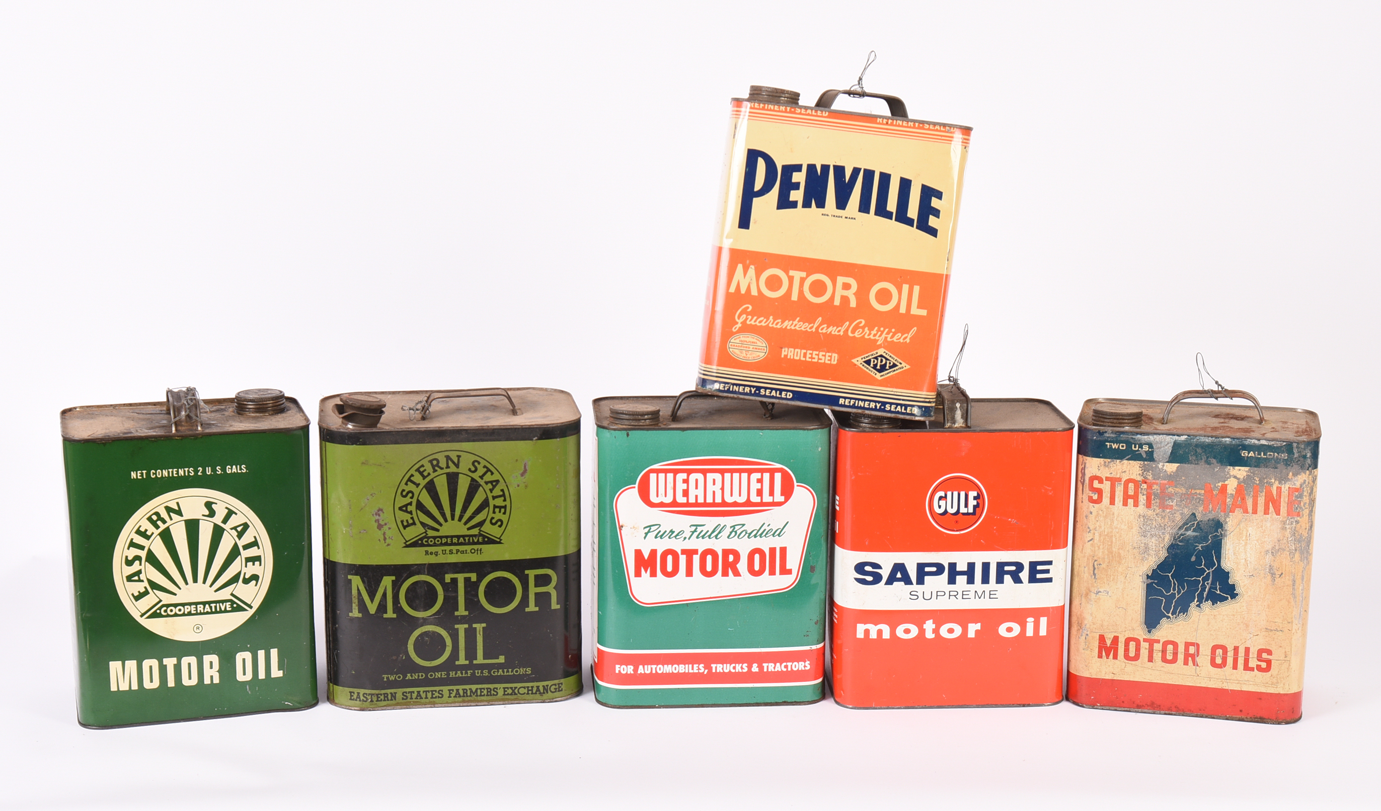 Six Vintage Motor Oil Cans.