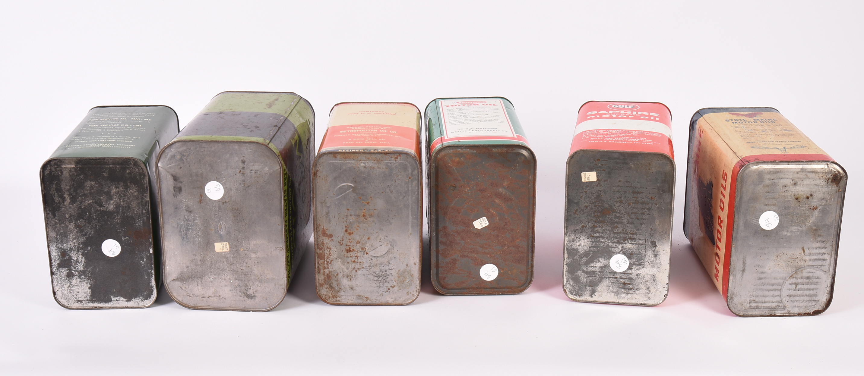 Six Vintage Motor Oil Cans.