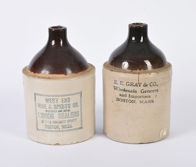 Two Stoneware Merchant Jugs. E. E. Gray & Co. Whoelsale Grocers, and West End Wine & Spirits 