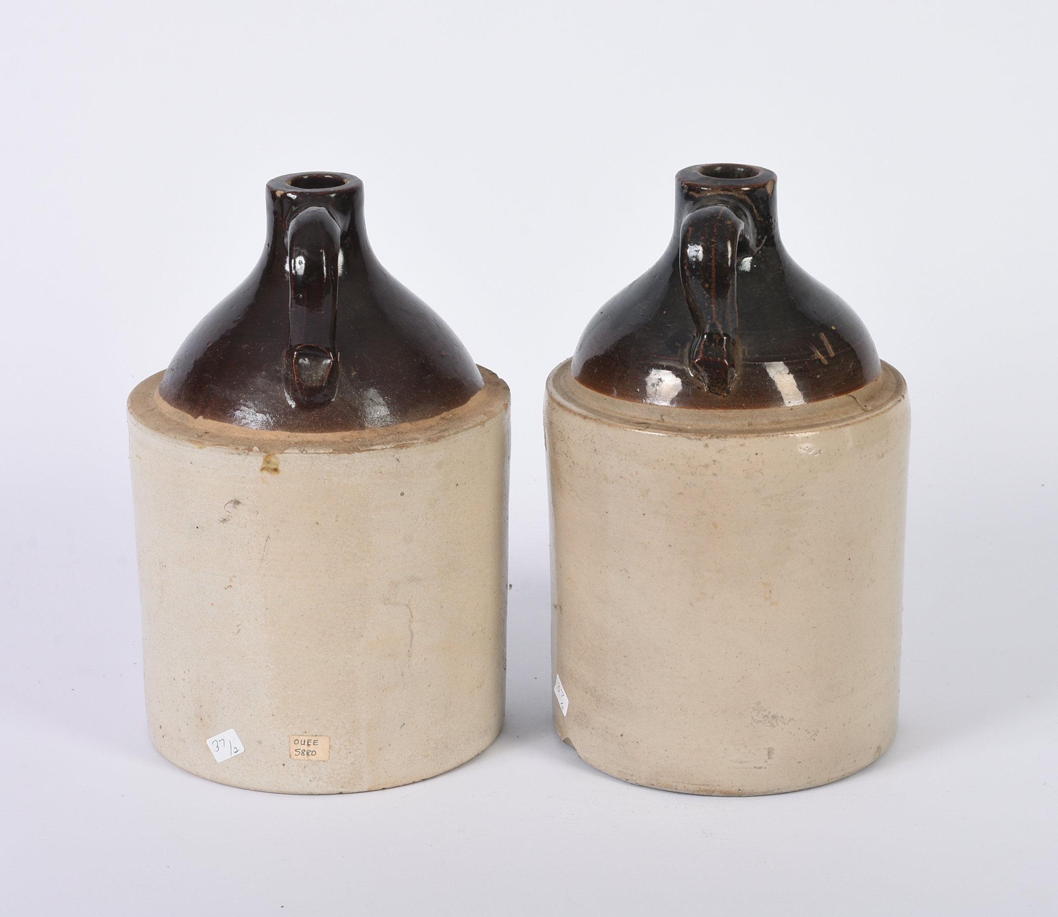 Two Stoneware Merchant Jugs.