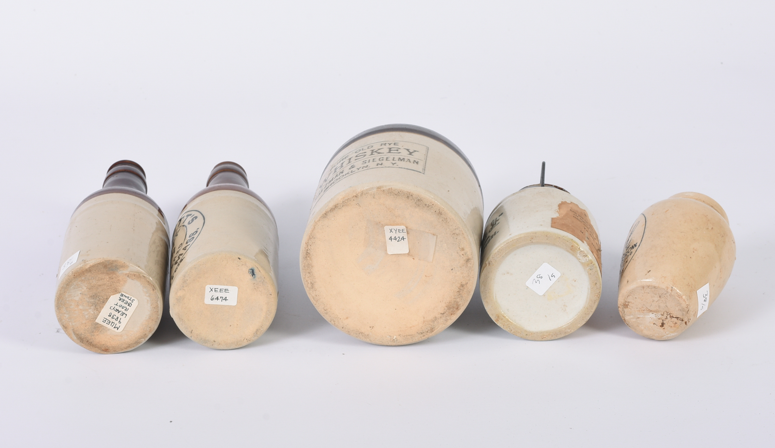 Five Small Stoneware Jars, Bottles, and a Jug.