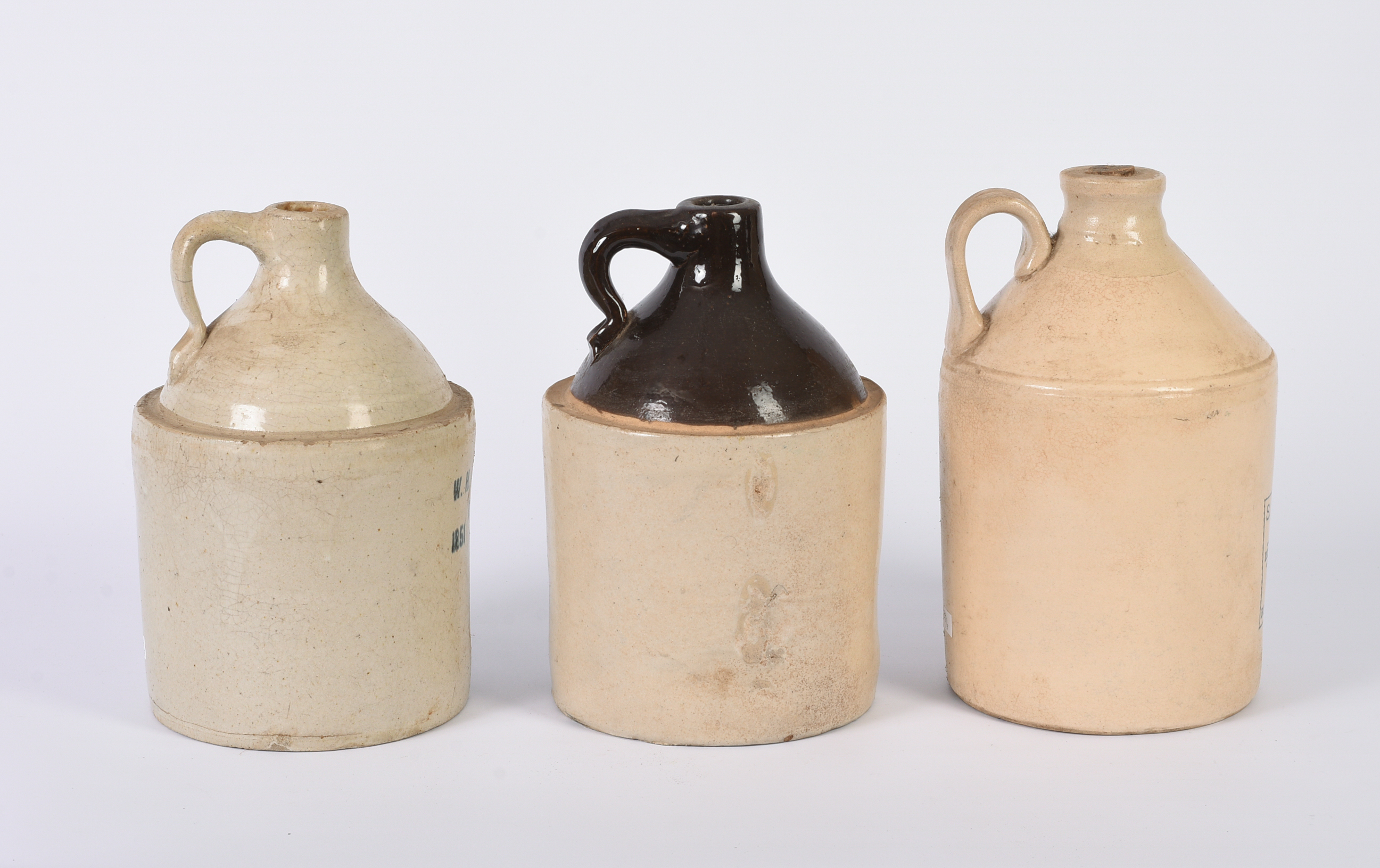 Three Advertising Stoneware Jugs.