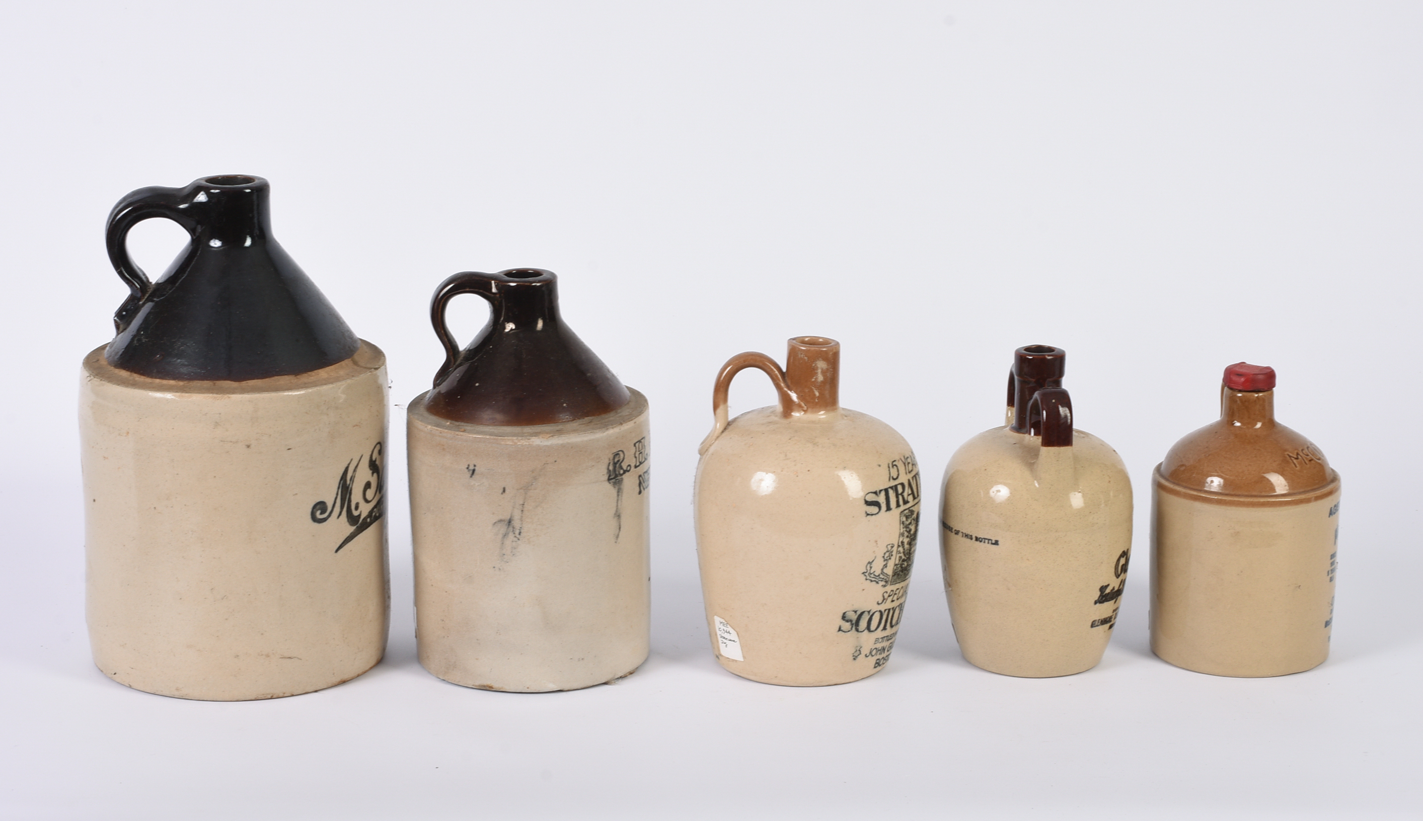Five Stoneware Advertising Jugs.
