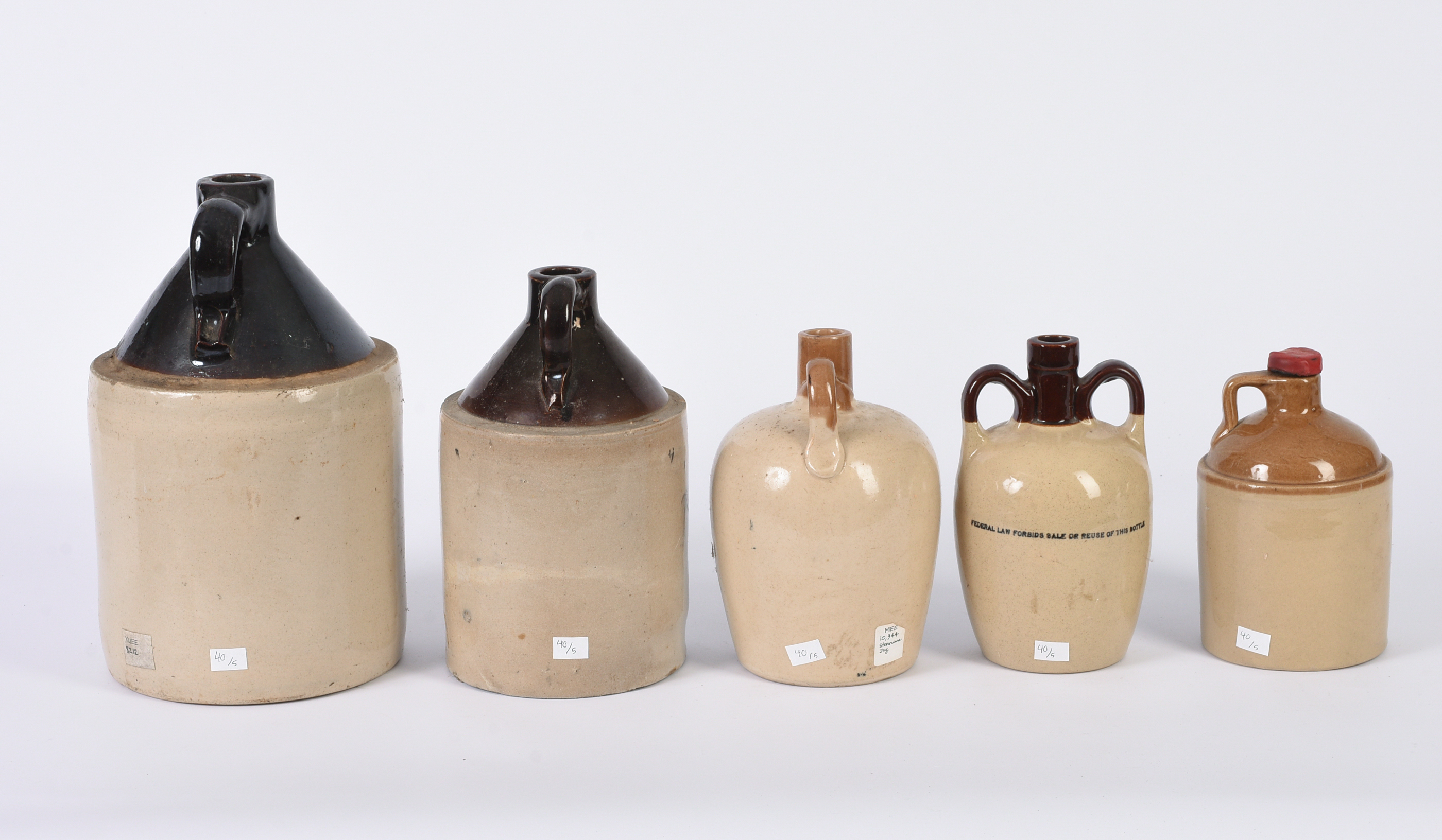 Five Stoneware Advertising Jugs.