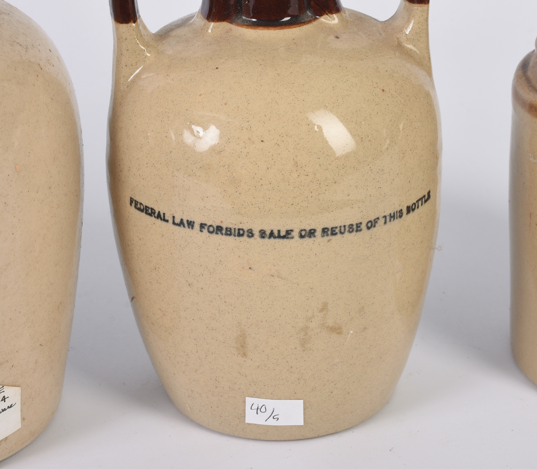 Five Stoneware Advertising Jugs.