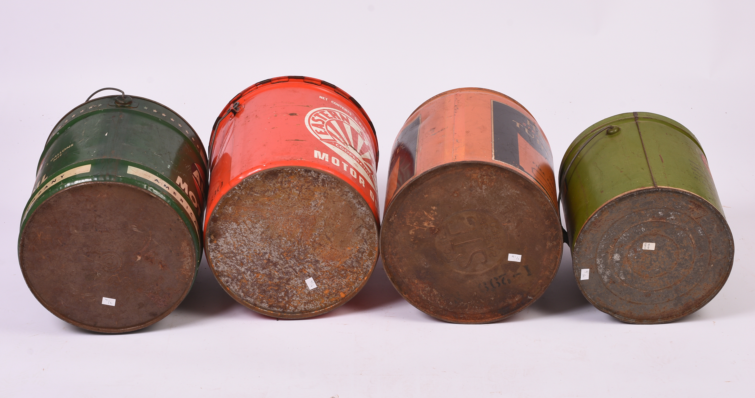 Four Large Advertising Cans.