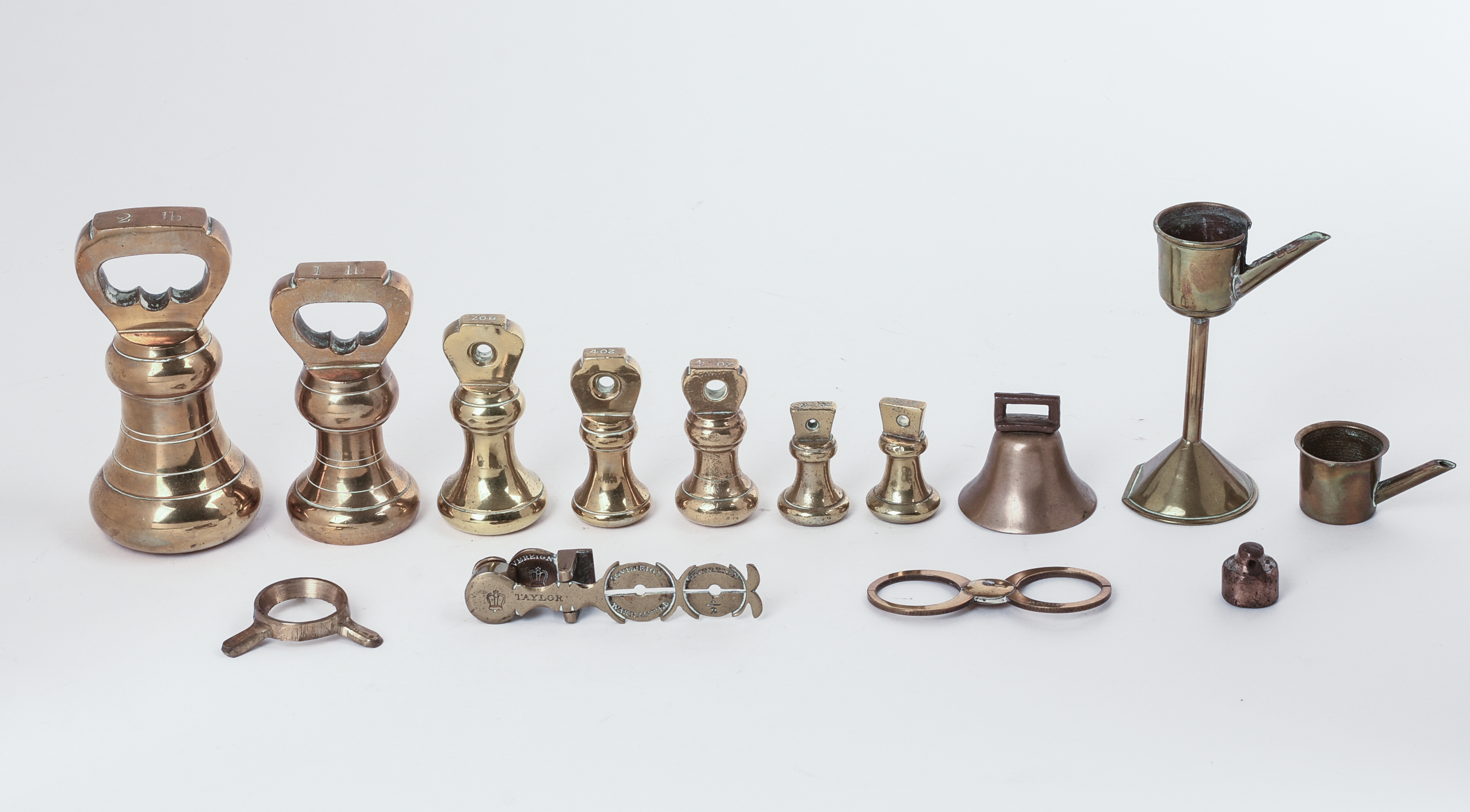 Set of Brass Weights and an Oil Lamp.