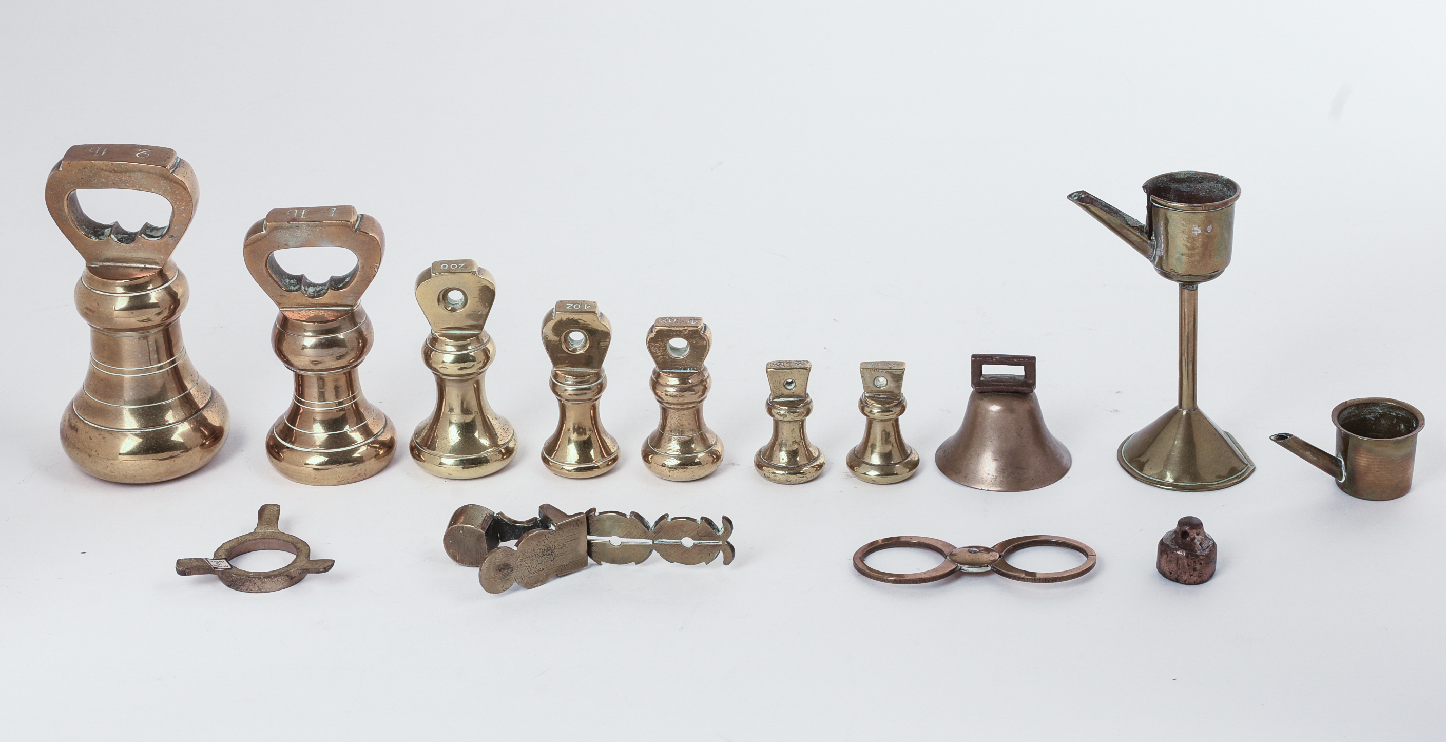 Set of Brass Weights and an Oil Lamp.