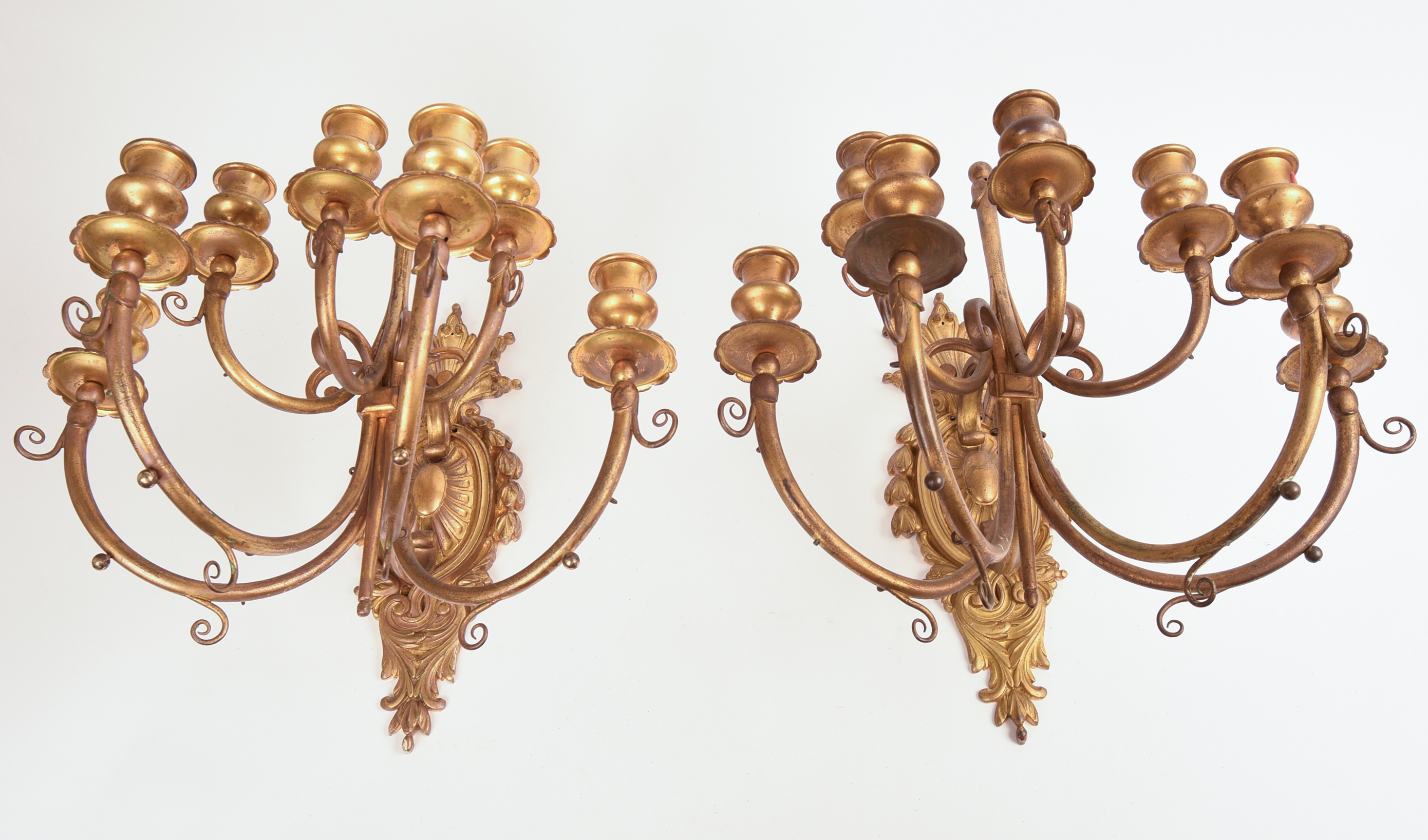 Pair of Ornate Gilt Metal Seven Light Wall Sconces.