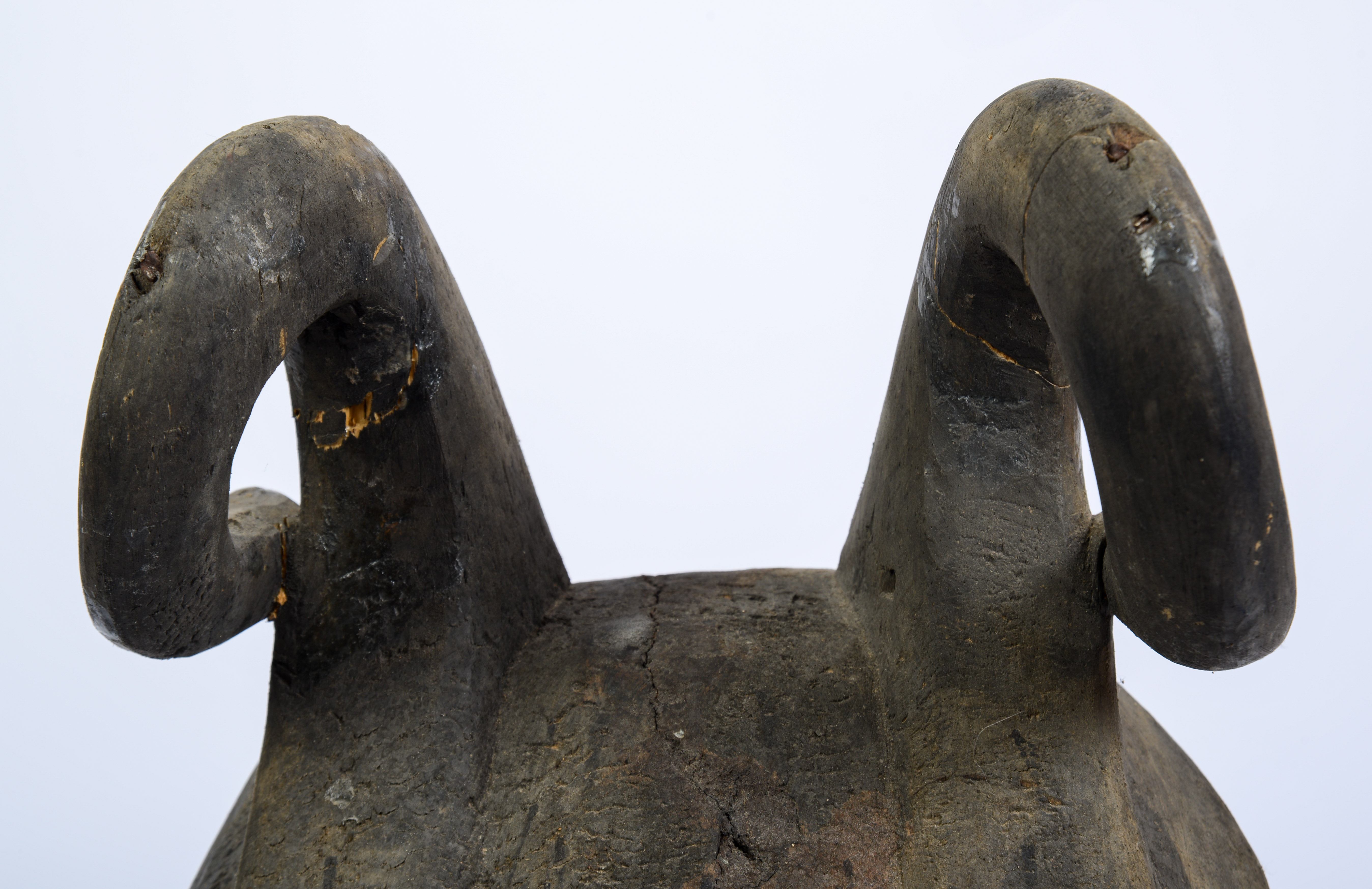 African Carved Figure of a Seated Man.