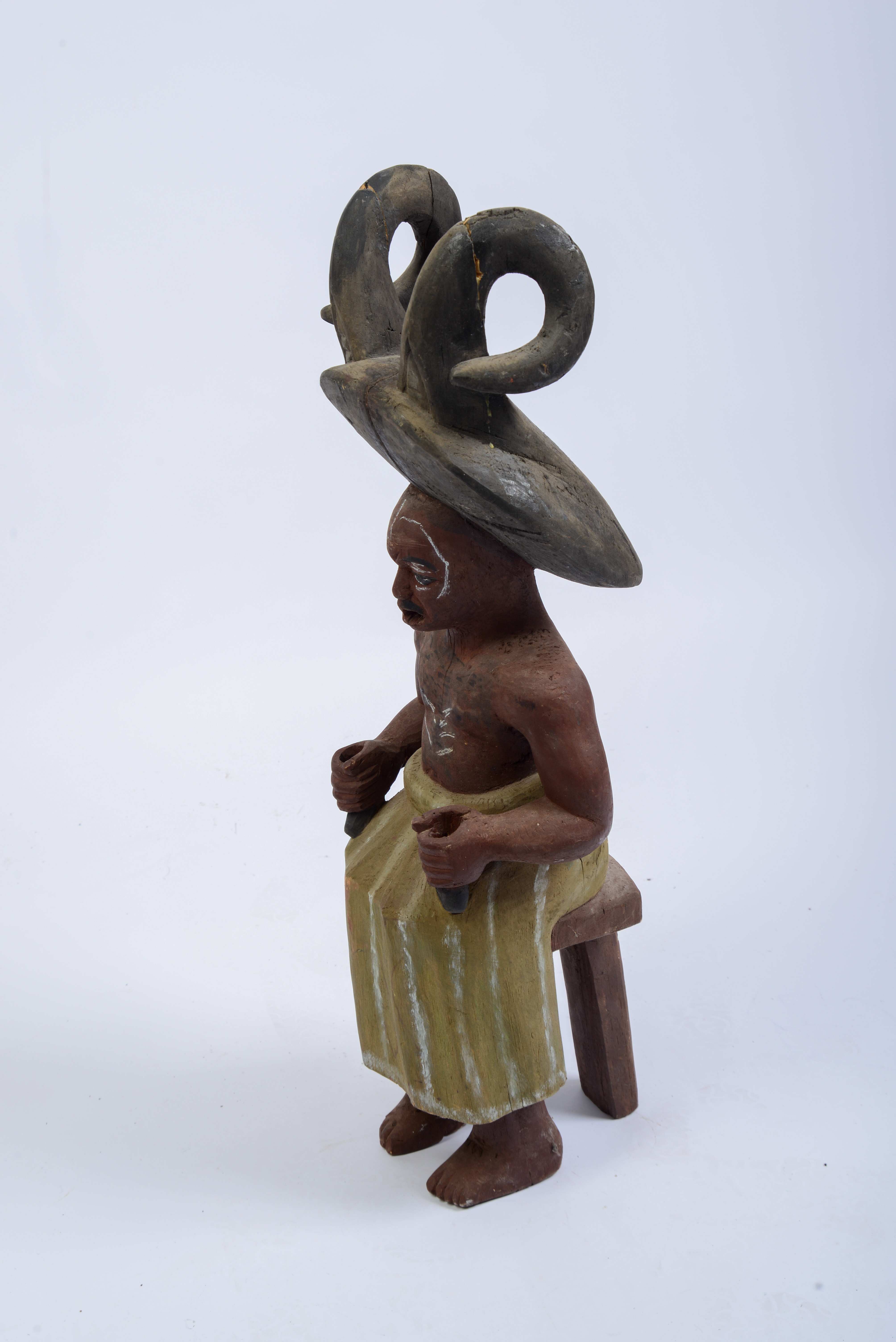 African Carved Figure of a Seated Man.