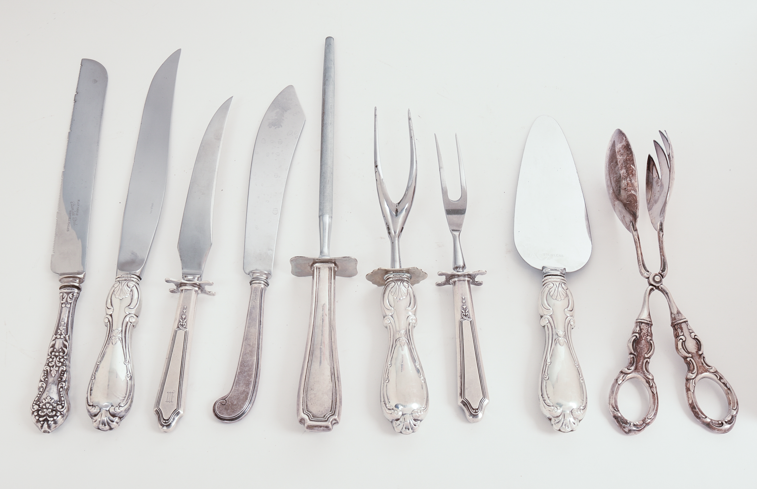Nine Antique Sterling Handled Serving Utensils and Knives