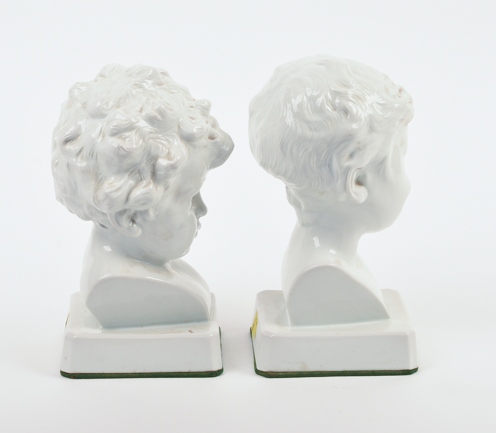 Pair of Signed Continental White Porcelain Busts of Boys