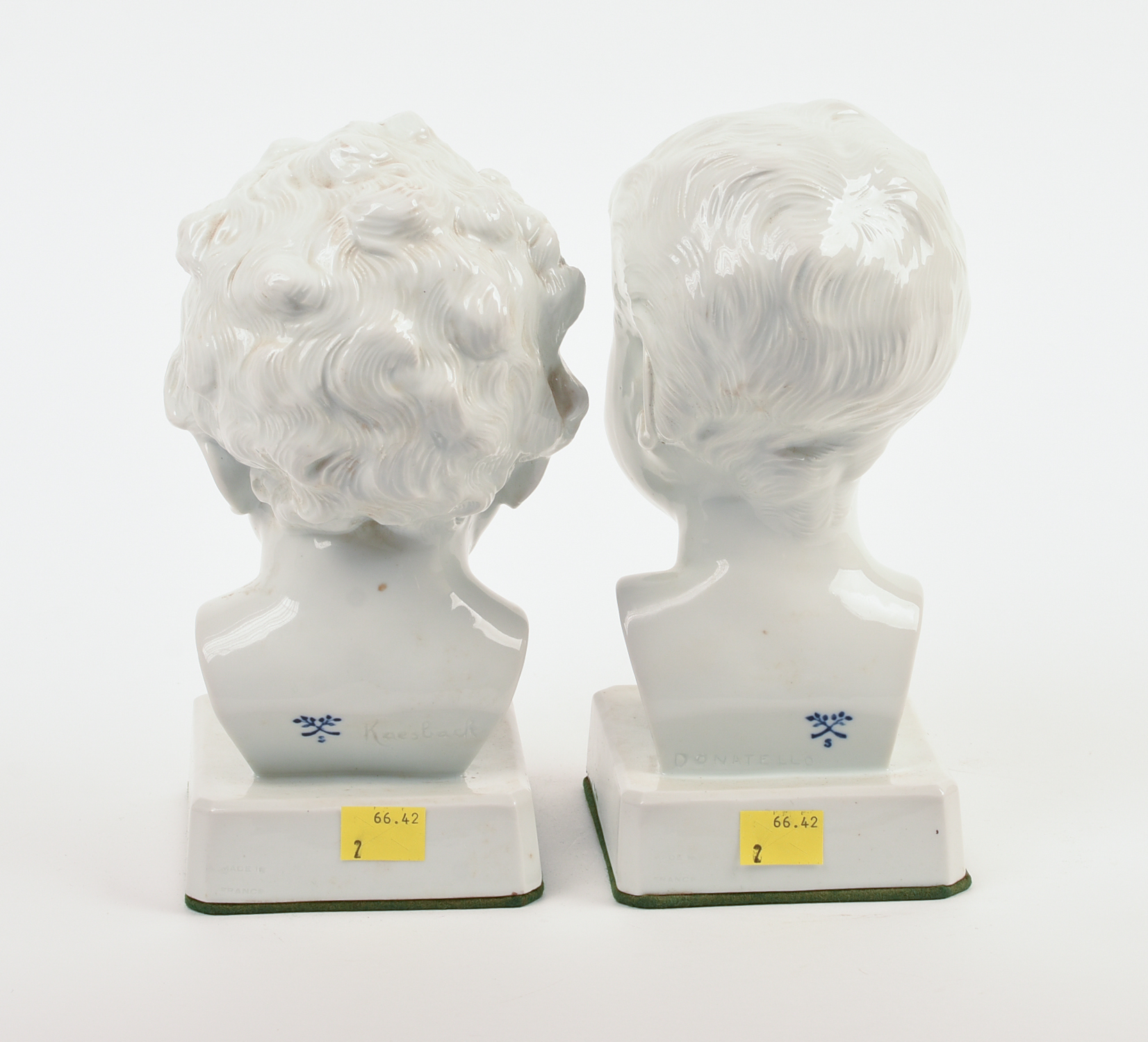 Pair of Signed Continental White Porcelain Busts of Boys