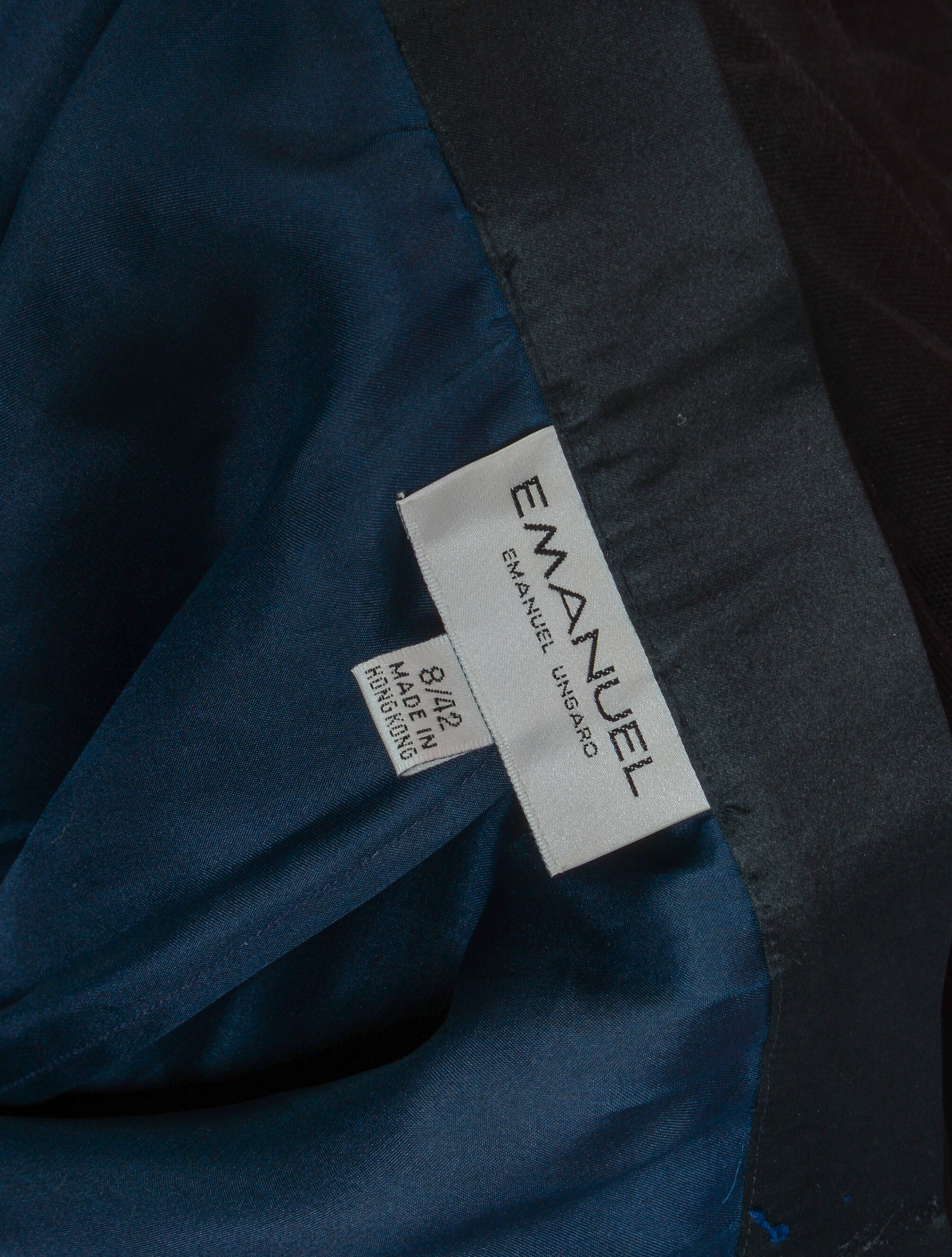 GROUP OF DESIGNER CLOTHING.