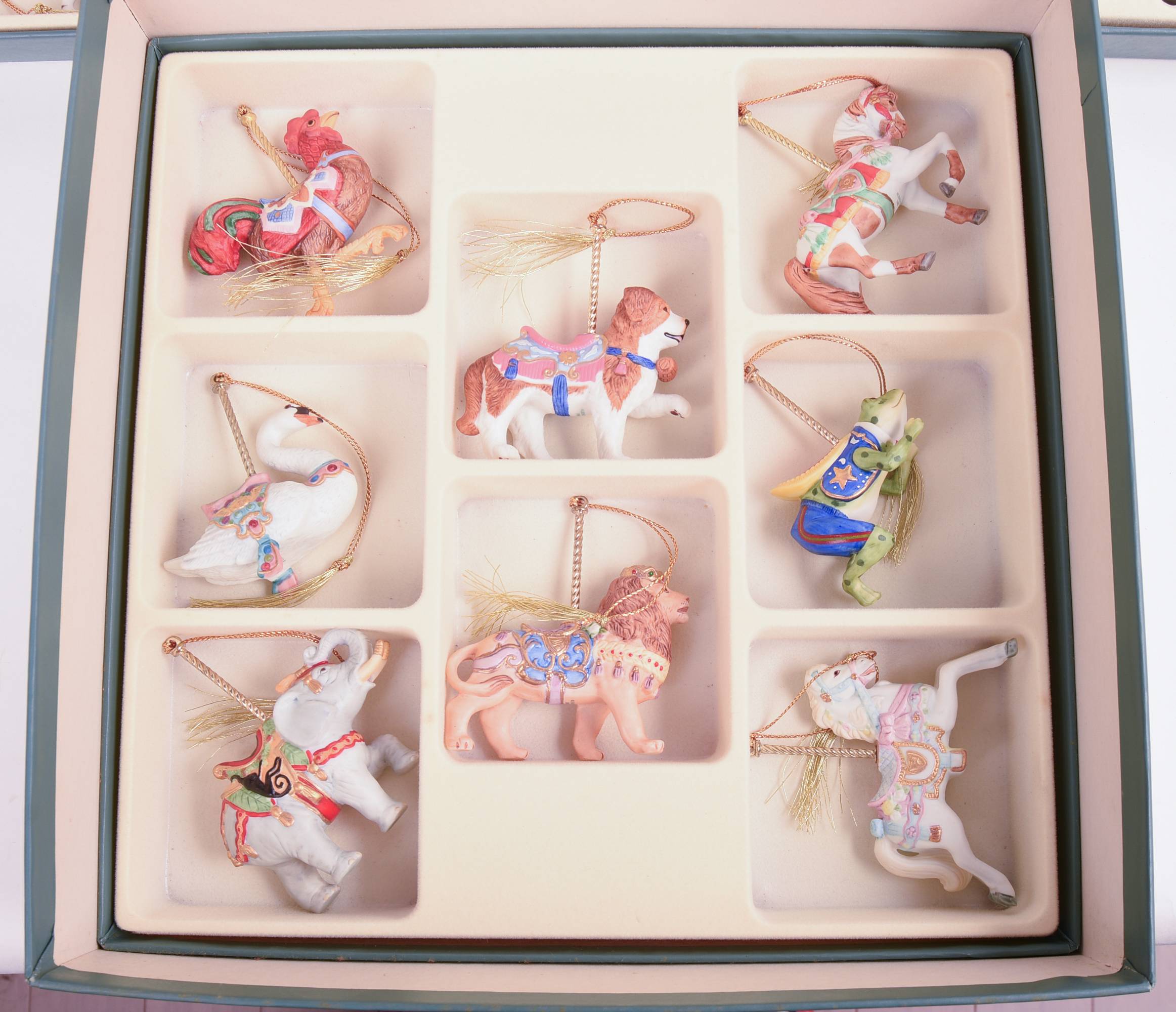 TWENTY FOUR LENOX CAROUSEL ANIMAL CHRISTMAS ORNAMENTS.