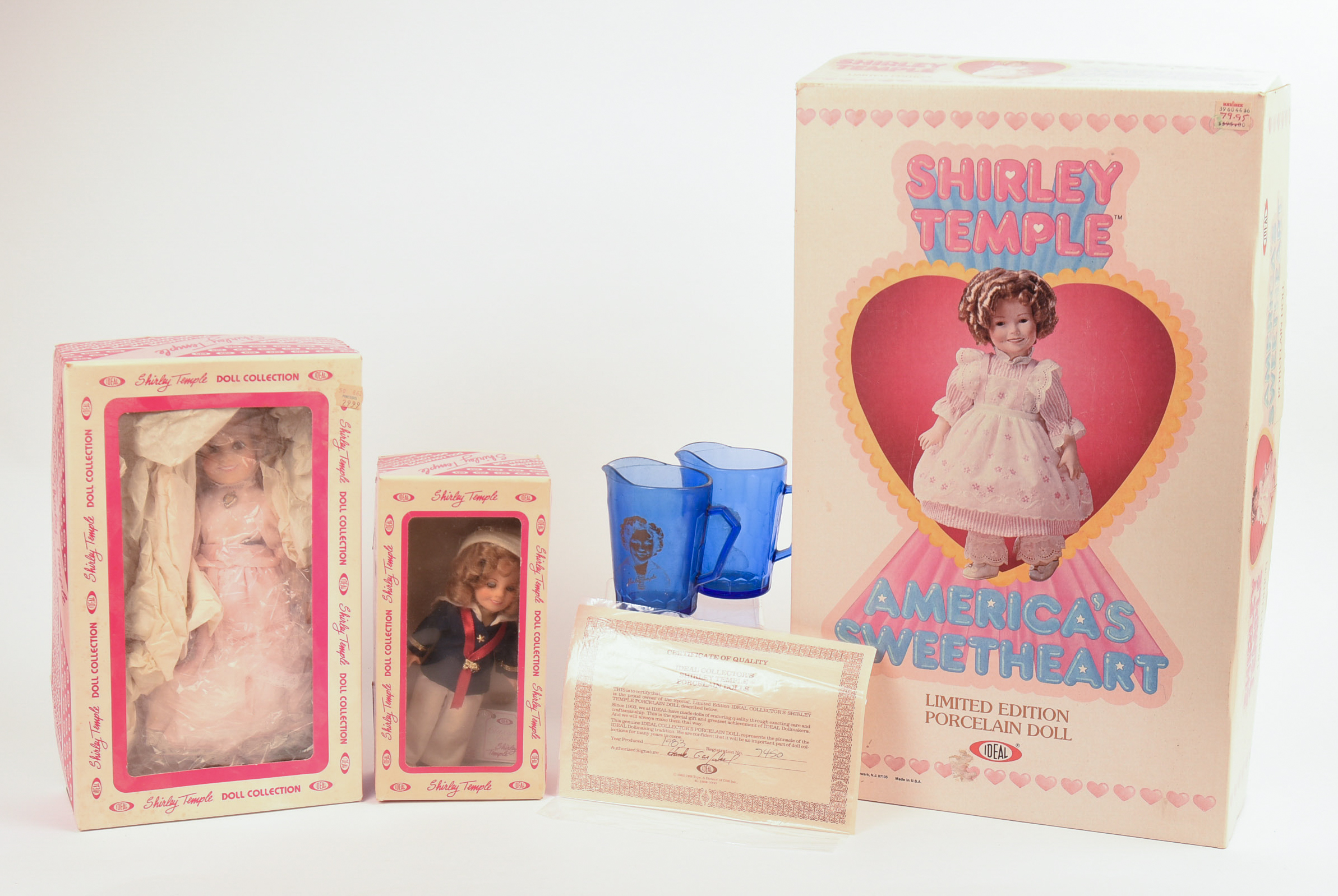 Three Ideal Shirley Temple Dolls and Two Glass Pitchers