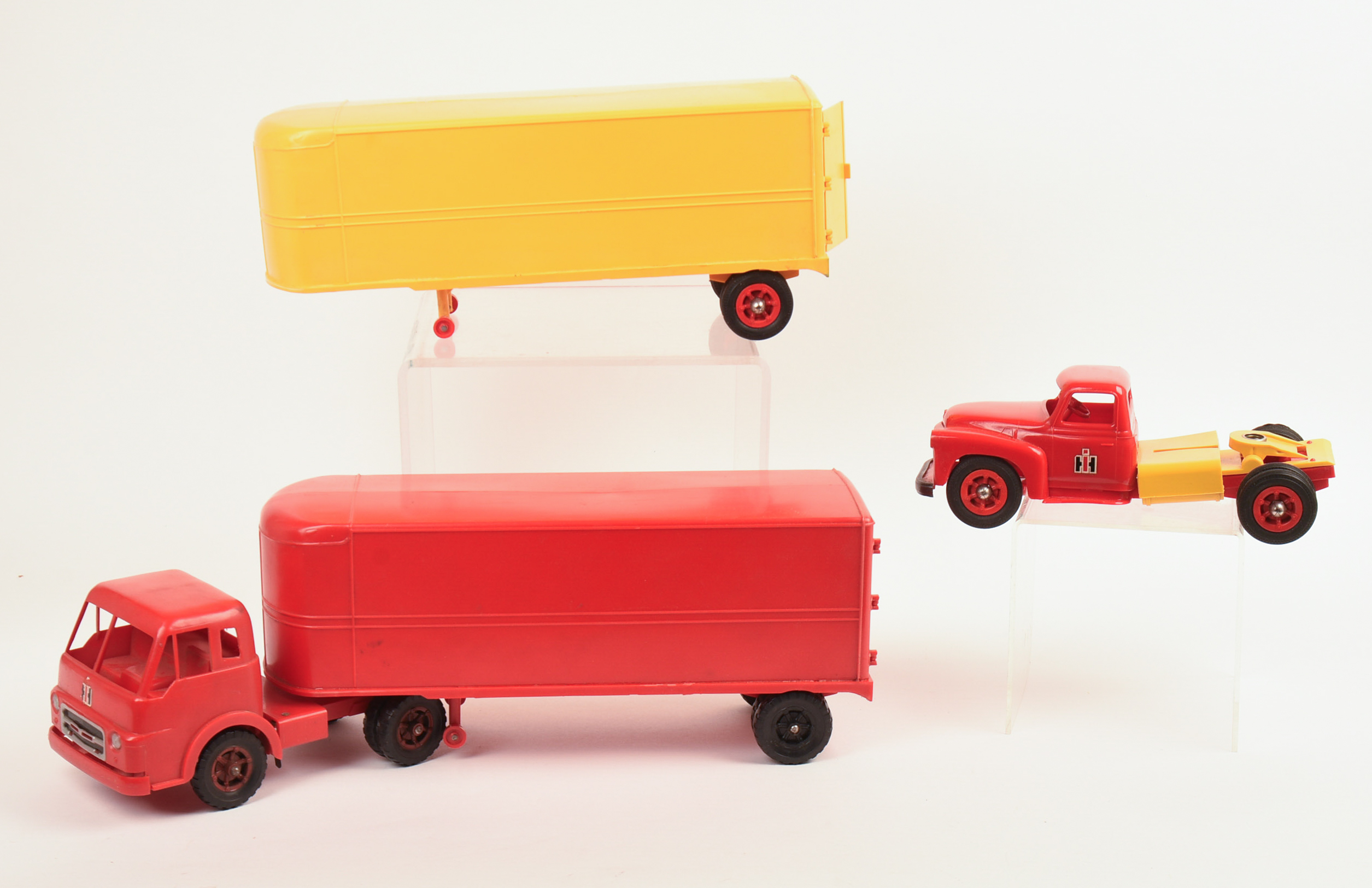 Two International Toy Trucks and a Trailer.